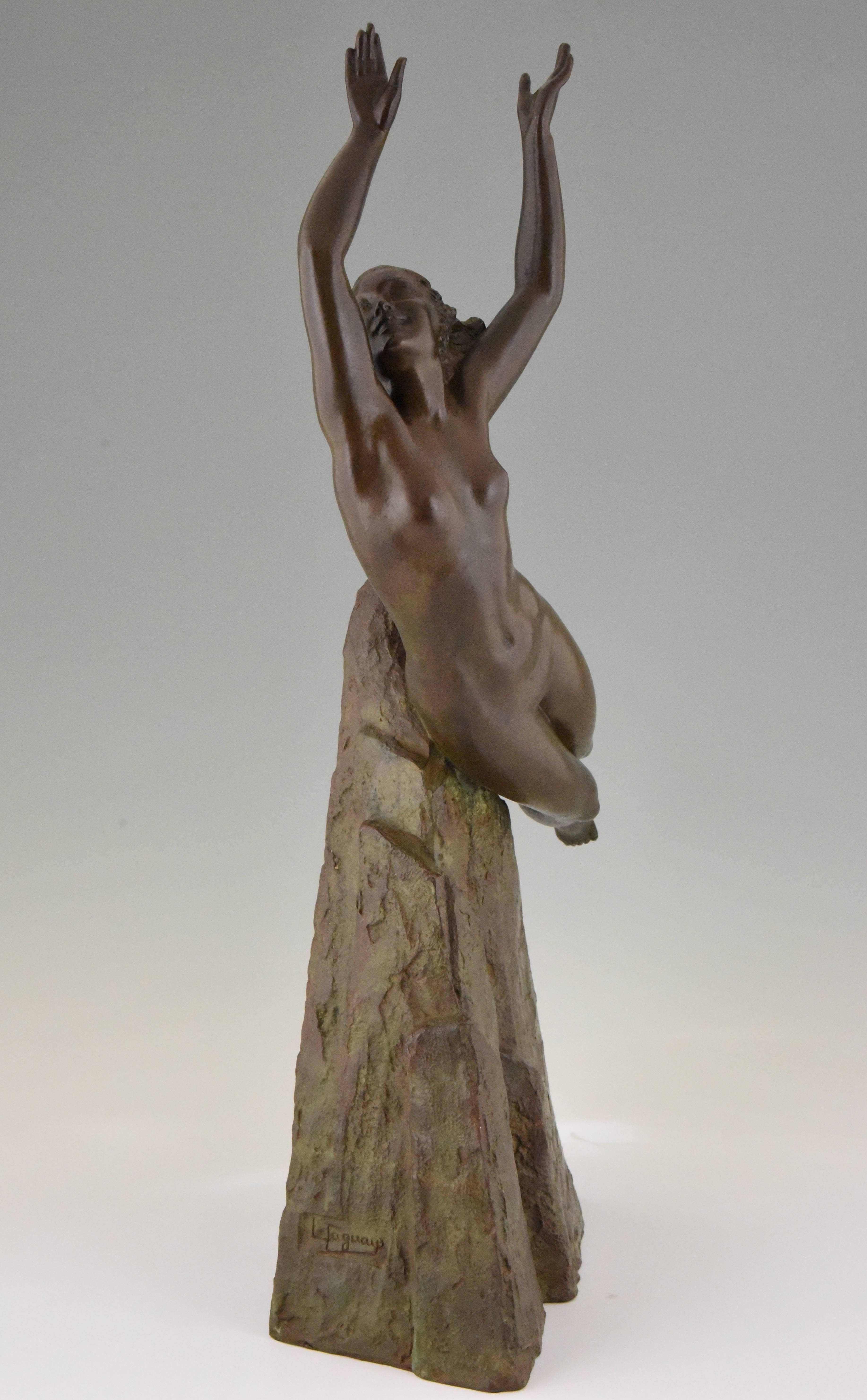 Spectacular 28.7 inches tall Art Deco bronze sculpture of a nude floating in air, the base is modelled as a rock. The bronze is signed by the French artist Pierre Le Faguays and bears the Susse Freres signature as well as the lost wax stamp,