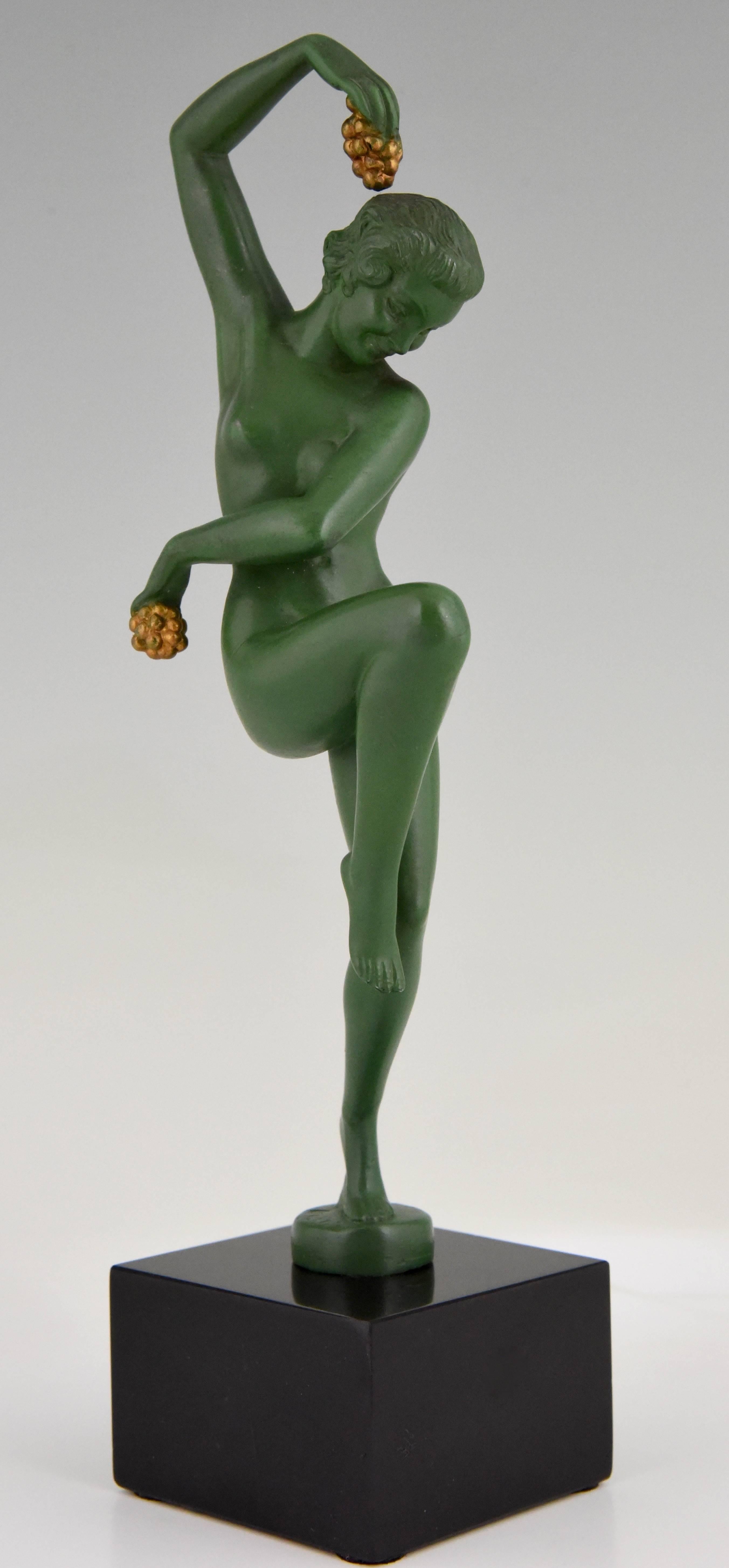Elegant Art Deco sculpture of a nude dancer holding grapes by the French artist Denis on a Belgian Black marble base. Signature/ Marks: Denis.
Style: Art Deco
Date: 1930
Material: Patinated art metal. Belgian black marble base.
Origin:
