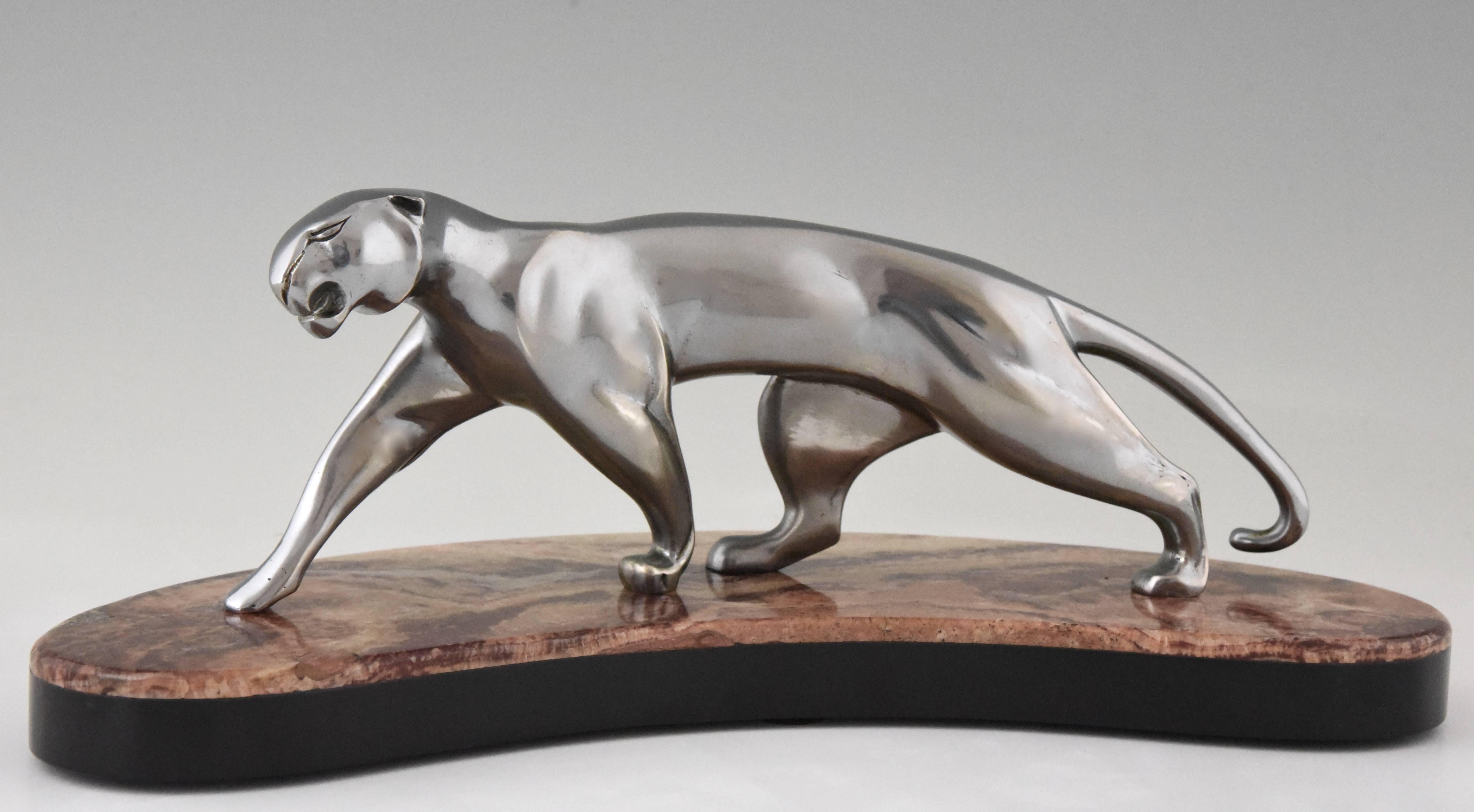 Stylish bronze sculpture of a panther by the famous French artist Michel Decoux. This bronze has its original nickel-plated patina and stands on a two color marble base.
Artist/ maker: Michel Decoux
Signature/ marks: Decoux, bronze.
Style: Art