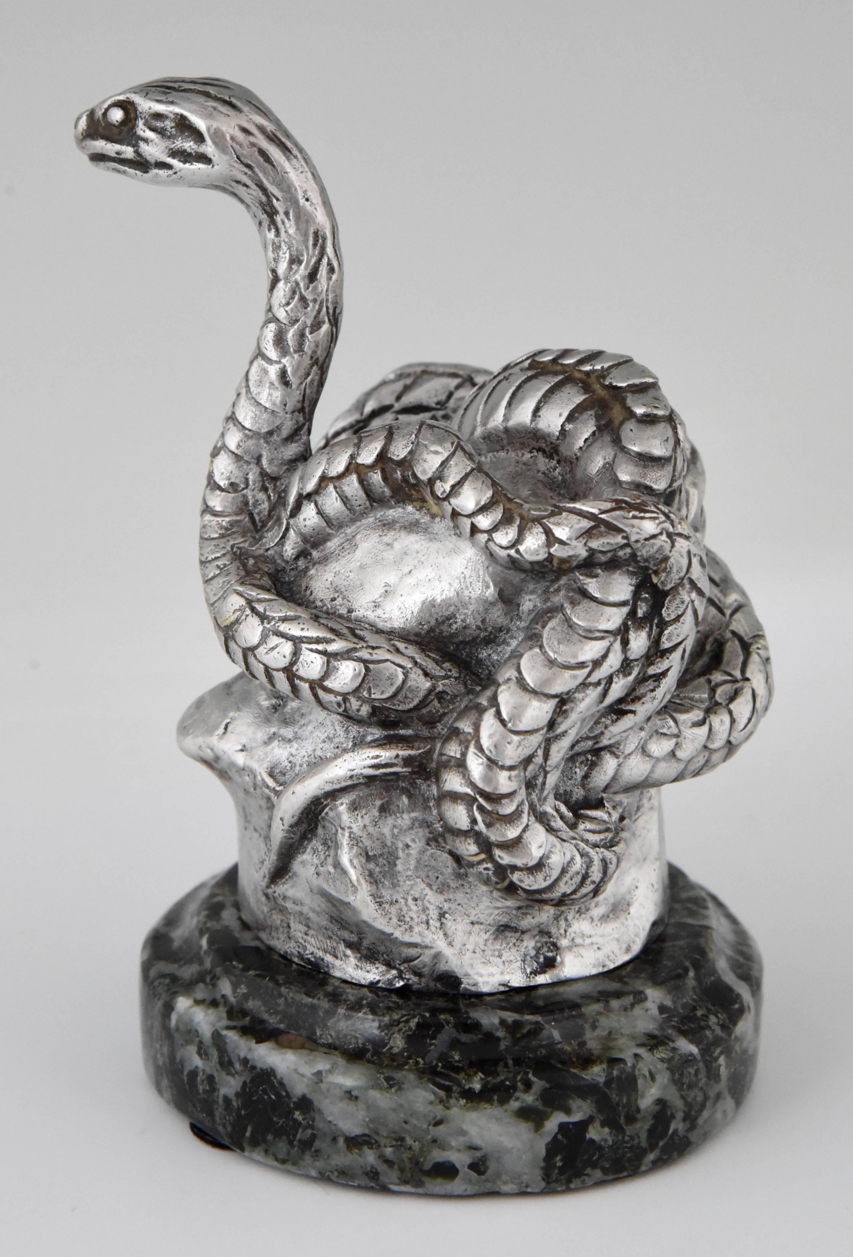 Hard to find antique bronze car mascot modelled as a snake by the French artist Antoine Bofill, signed and stamped by the foundry. The silvered bronze sculpture is mounted on a green marble base. 

Artist/ Maker: Antoine Bofill
Signature/ Marks: