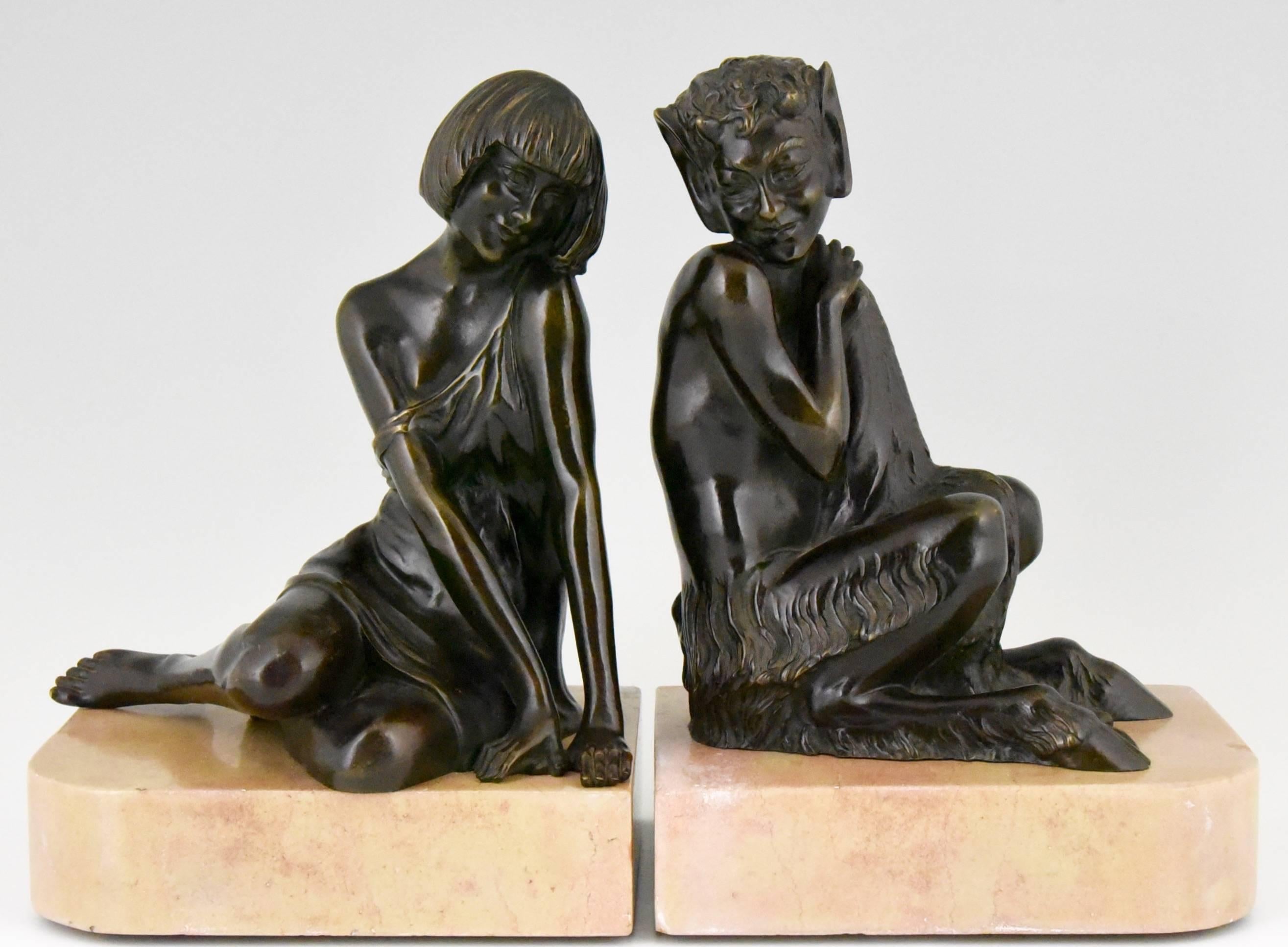 Title:  Faun and nymph. 
 Art Deco bronze bookends with a sitting satyr and nymph. 
Artist/ maker:  Le Faguays, Pierre 
Signature/ marks:  Le Faguays.  
Style: Art Deco.
Condition:  Very good condition.  
Minor restorations to the rim of the marble