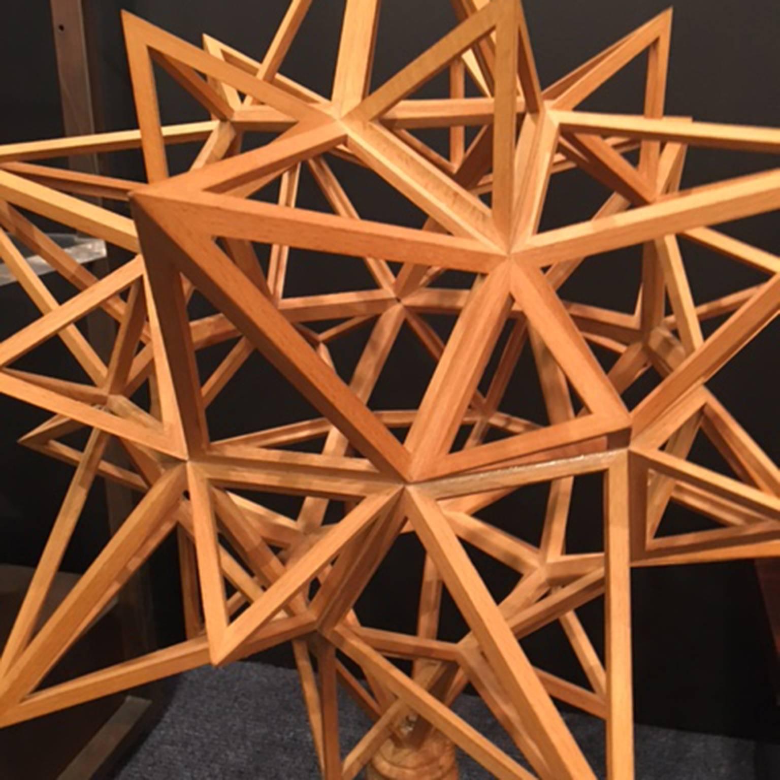 Mounted wood polyhedron.