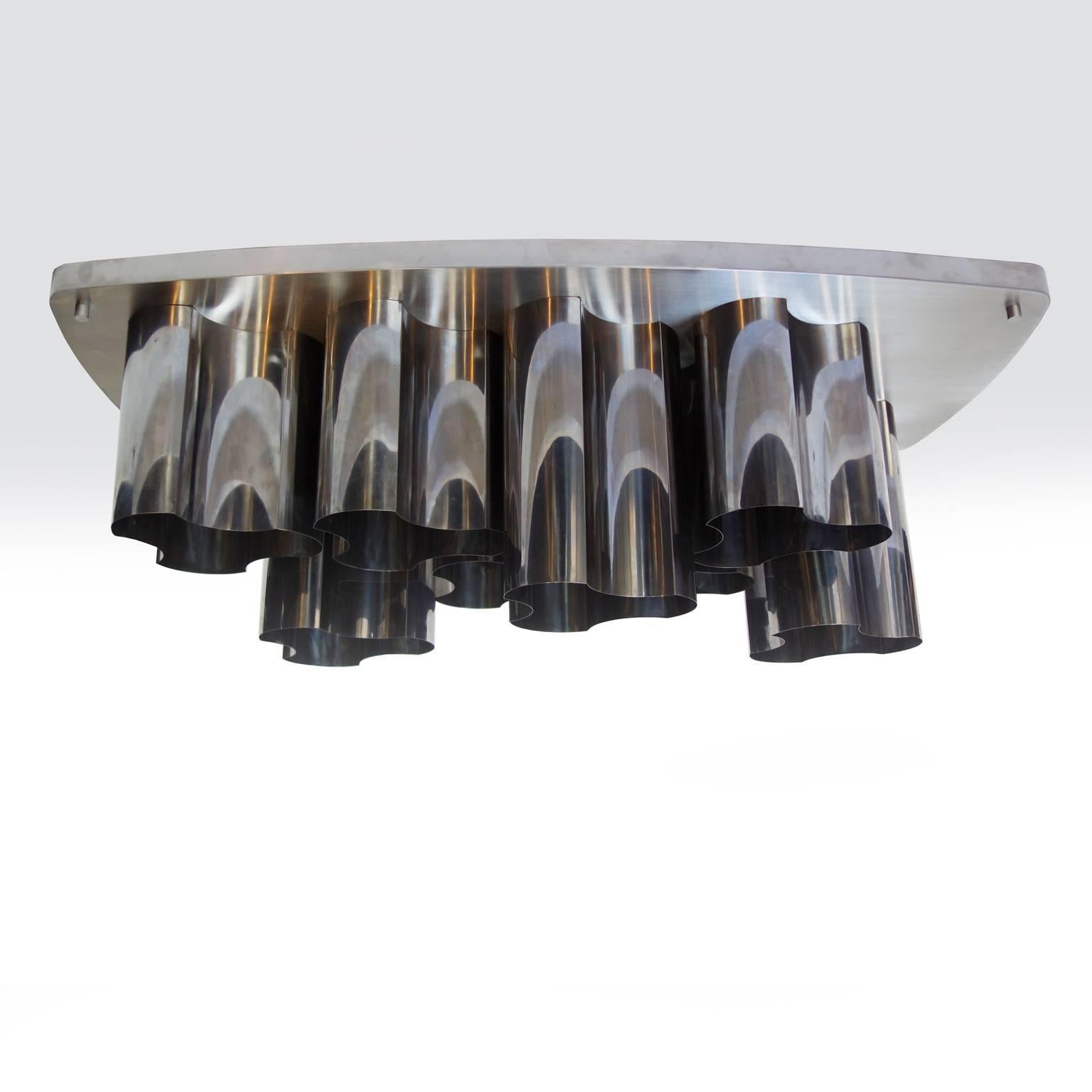 Aluminum ceiling fixture composed of eight modules on a brushed steel base.