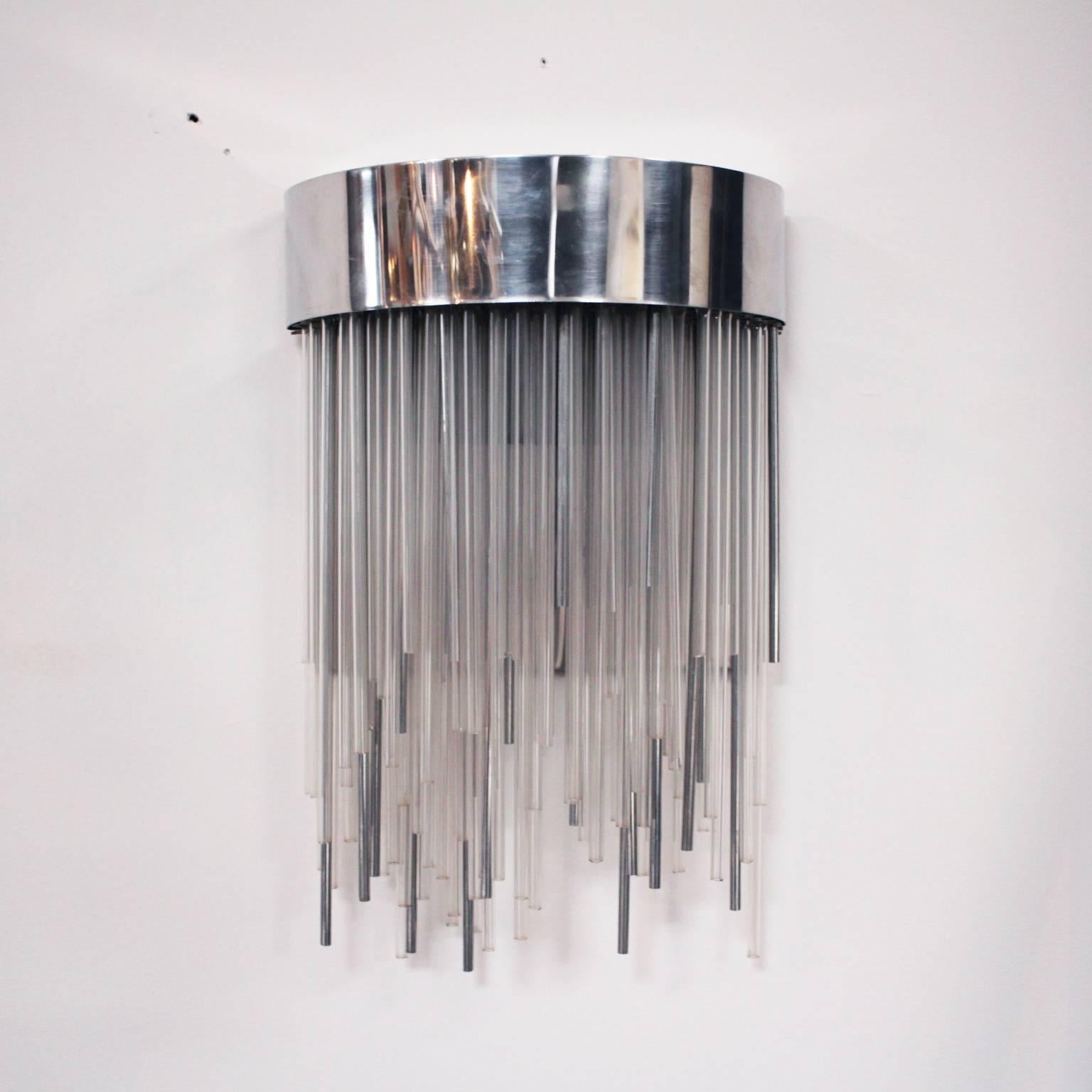 Pair of Italian sconces composed of glass and steel tubes in a half-moon structure.

All glass tubes are in perfect condition, there a few marks on the chromed metal tube and structure.