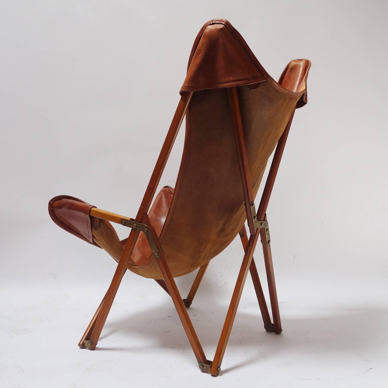 Foldable leather folding chair in the spirit of Joseph Beverly Fenby.

Inspired by the Tripolina chair, made from prior to WWII by the firm of Viganò in Tripoli, Libya, for the expatriate Italian market as a camping chair of great stability in