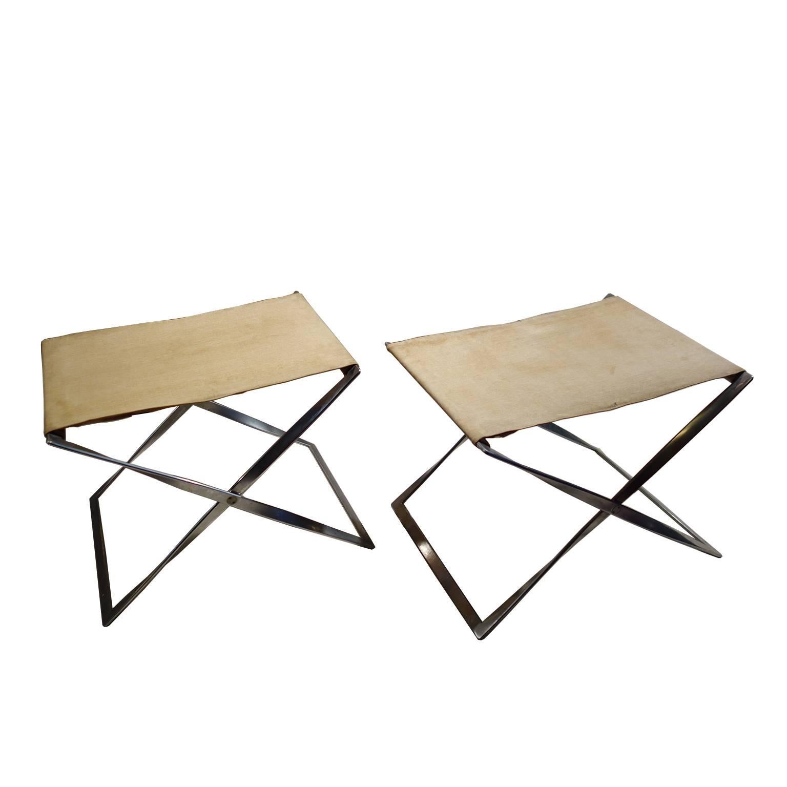 Beautiful pair of foldable stools, model PK91, designed by Poul Kjaerholm.

Steel structure with original canvas seats from 1961.
The seats could be upholstered with new canvas if requested.