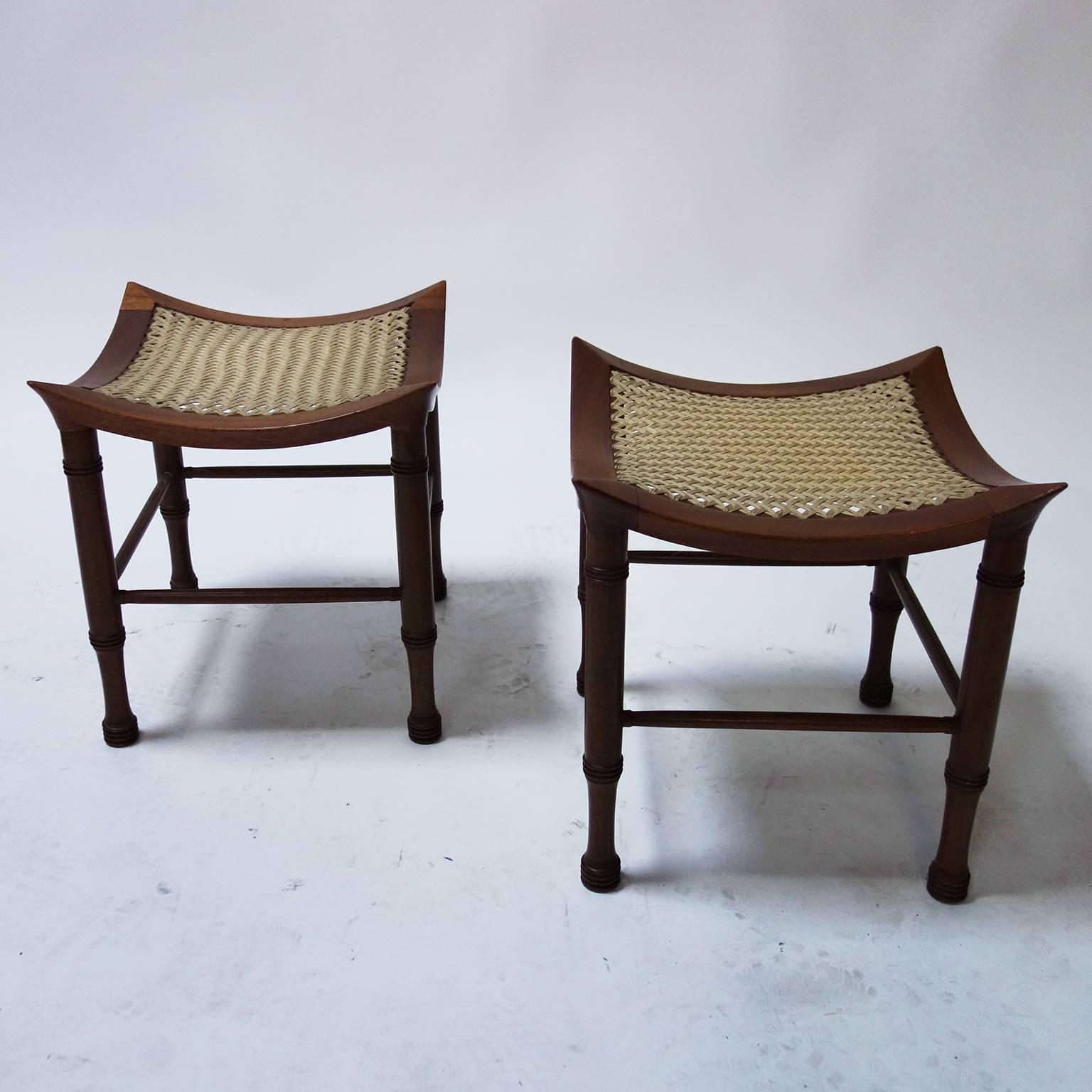 Pair of Arts & Crafts 'Thebes' stool by Liberty & Co with curved seat.

Turned walnut legs and stretchers.
Woven jute seats.

Original condition.

From Melina Mercouri private collection.