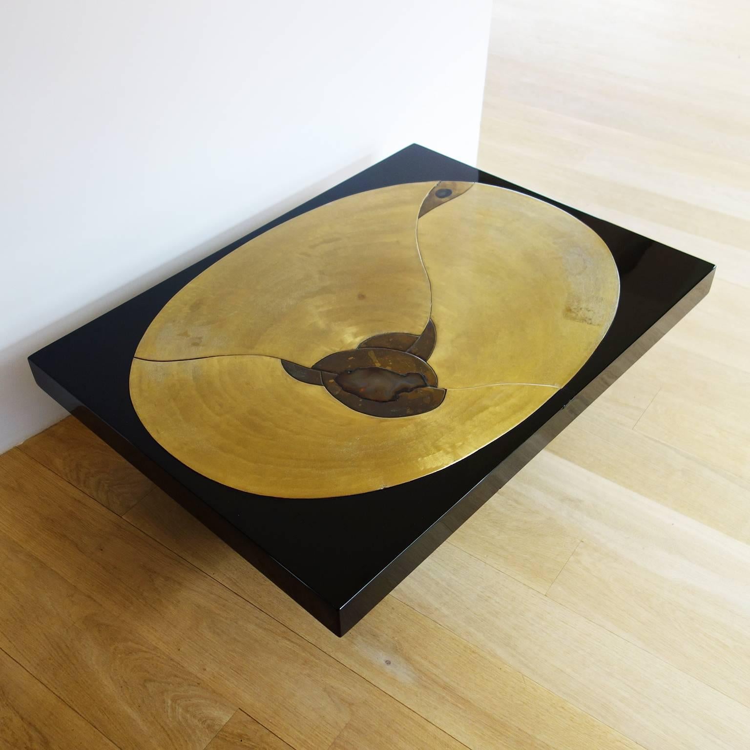 Black lacquered wood with etched brass and polished agate.