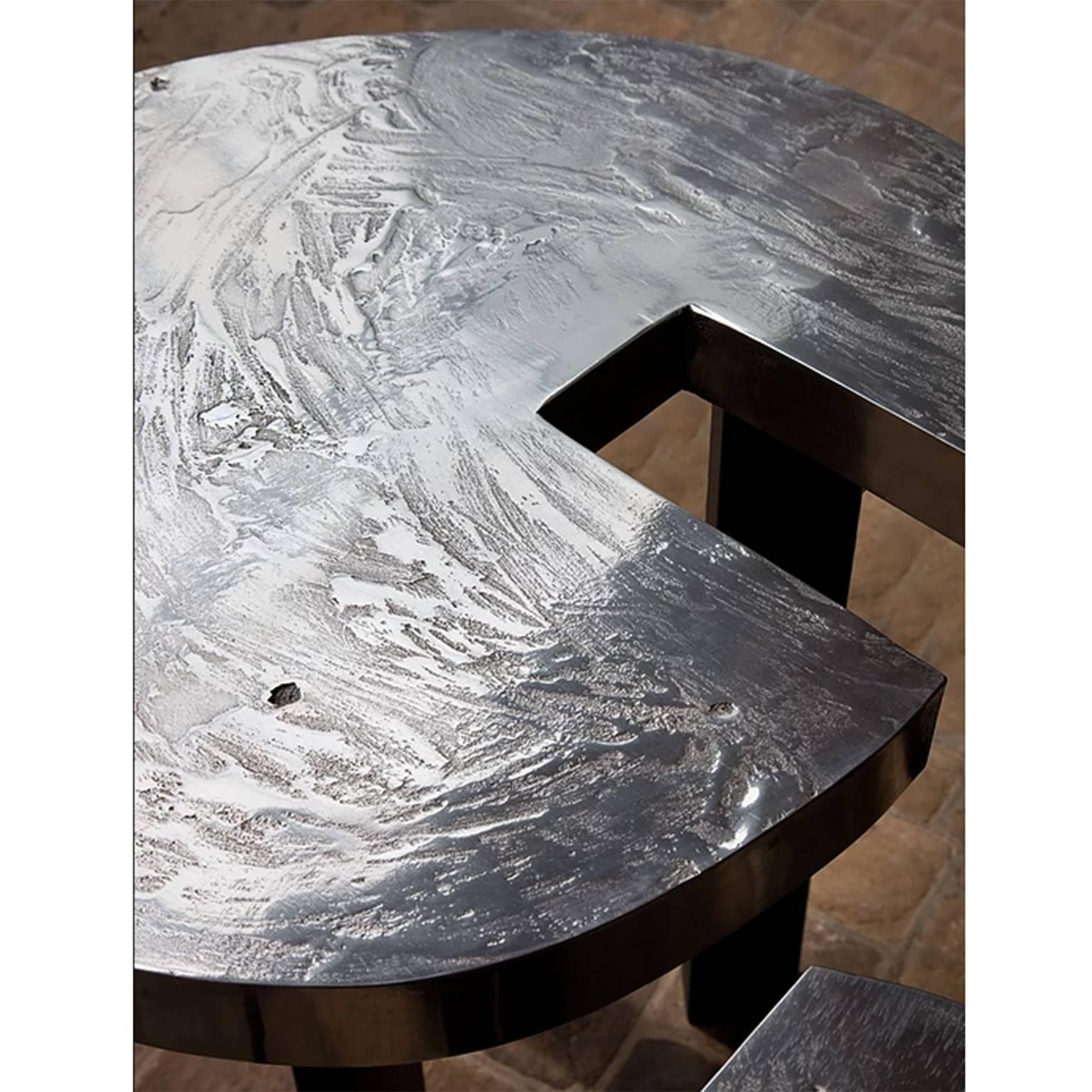 Superb coffee table by Ado Chale.

Composed of four separate tabletop with custom tripod legs.
Surface imprints with irregular moon relief.

From a drawing of 1973, edited in 2013.

Still in production, please note that if not in stock the