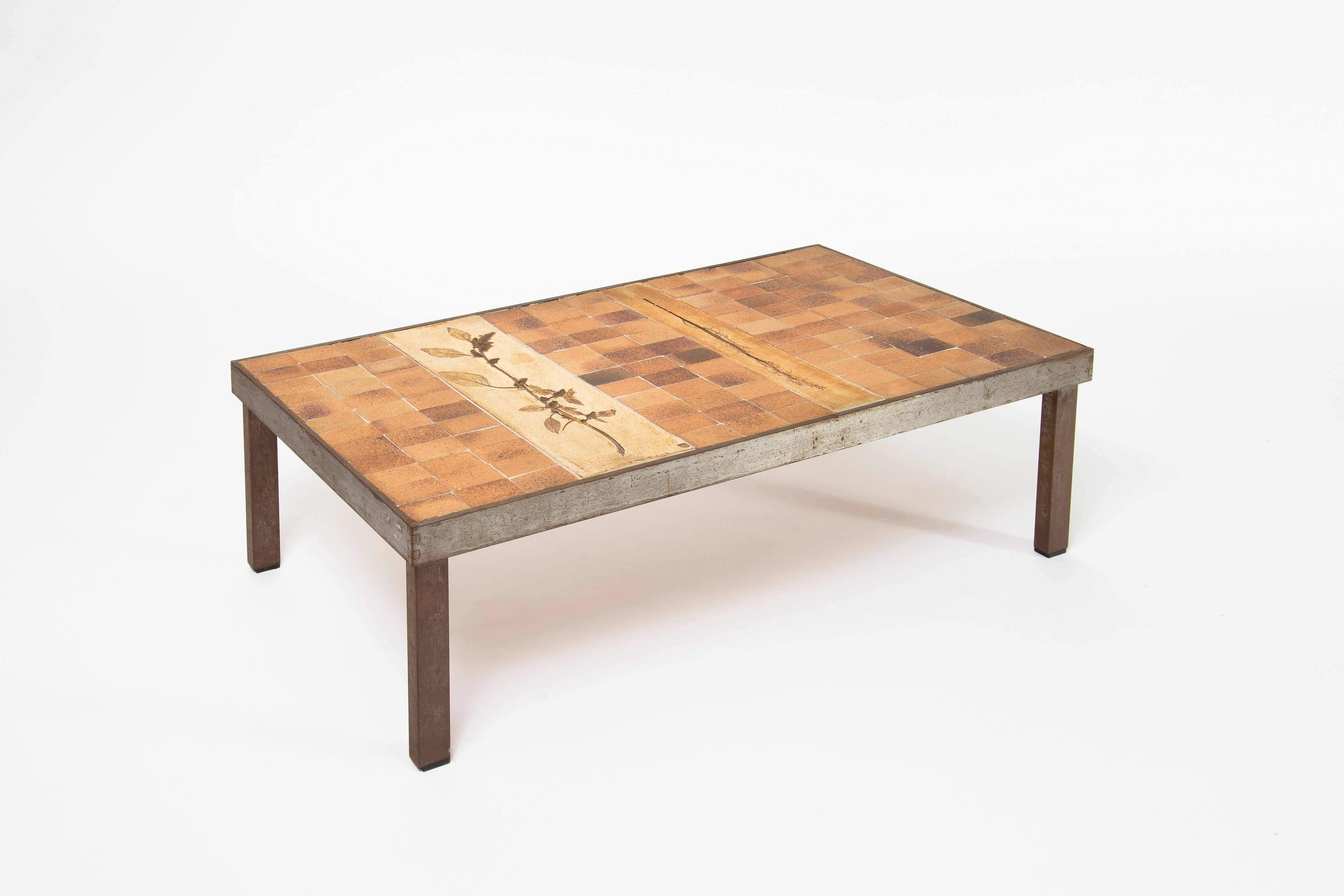 Low table from the "Garrigue" series by the French ceramicist Roger Capron in Vallauris. Ceramic tiles with an impressed branches decor and patined metal frame. Stamped marks (see last image).