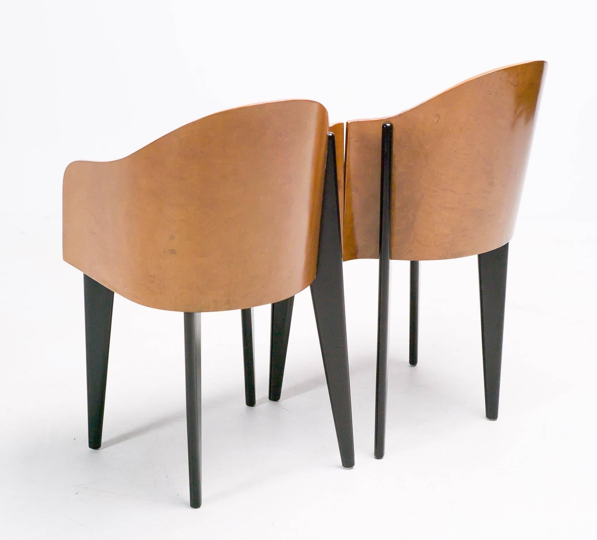 A wonderful pair of asymmetrical chairs by Saporiti.
Curved maple burl veneer back and black leather seat.
Toscana chairs. Piero Sartogo 1986.
 
