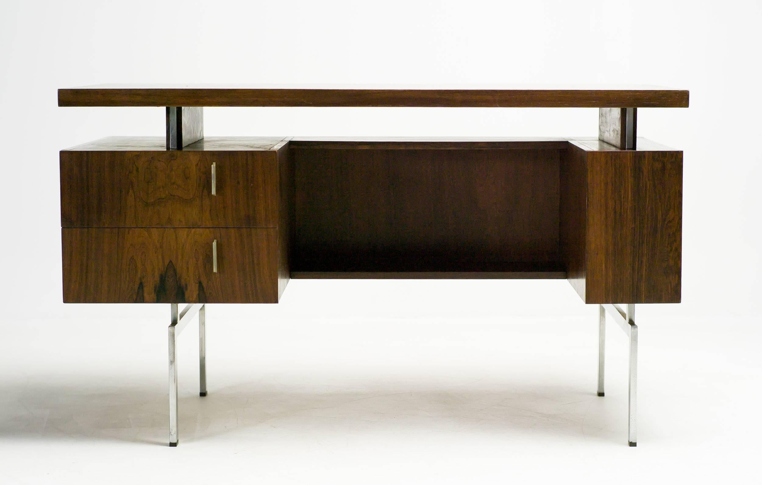 Spectacular Dutch Mid-Century Modern desk in rosewood and matte chromed steel. The finish of the legs as well as the drawer handles has worn off from age and use. 

Excellent fast and affordable worldwide shipping available.
     