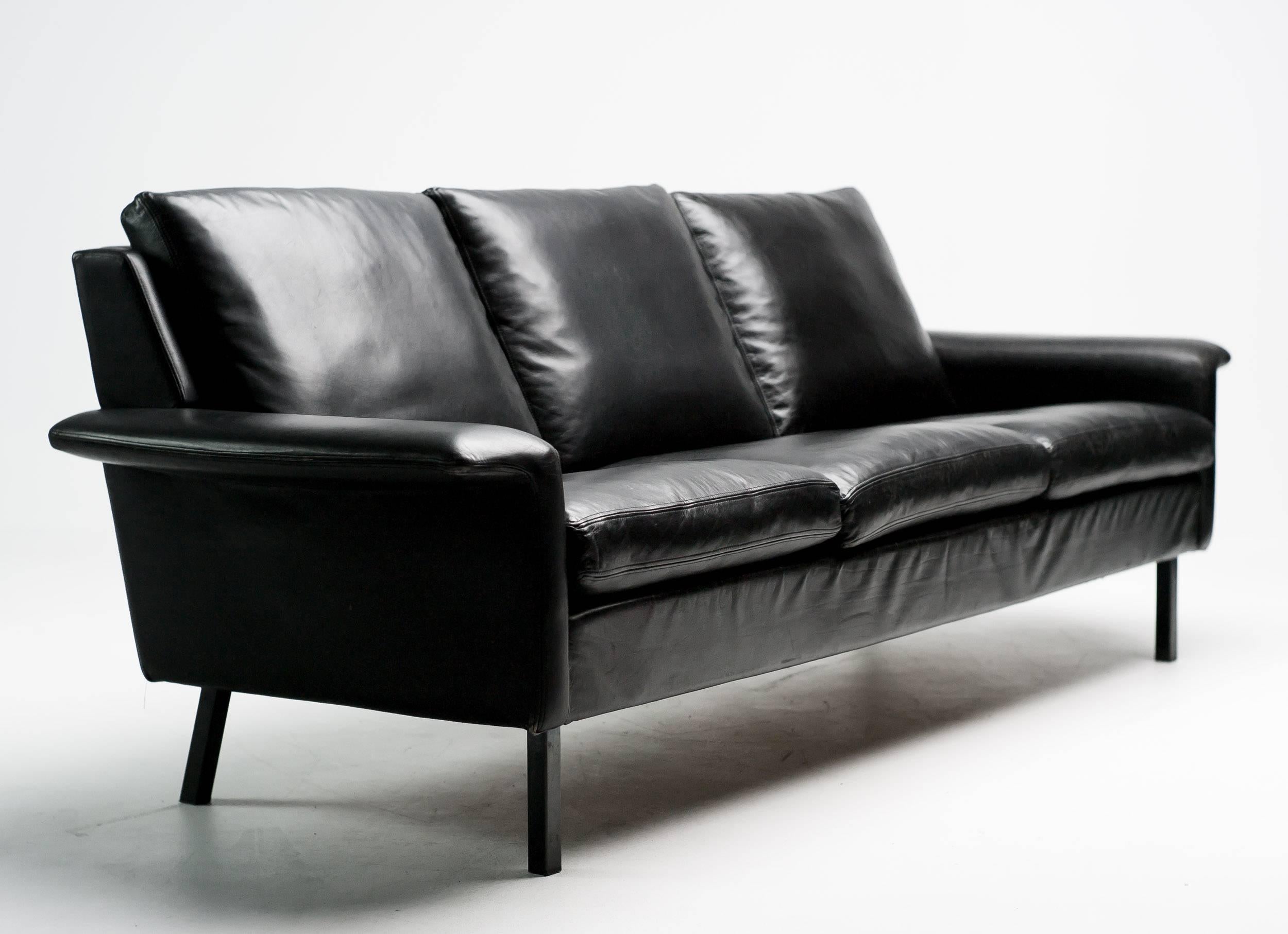 Comfortable down-filled sofa designed by Arne Vodder for Fritz Hansen. 
The original black leather is in excellent condition. 

Excellent fast and affordable worldwide shipping available.
