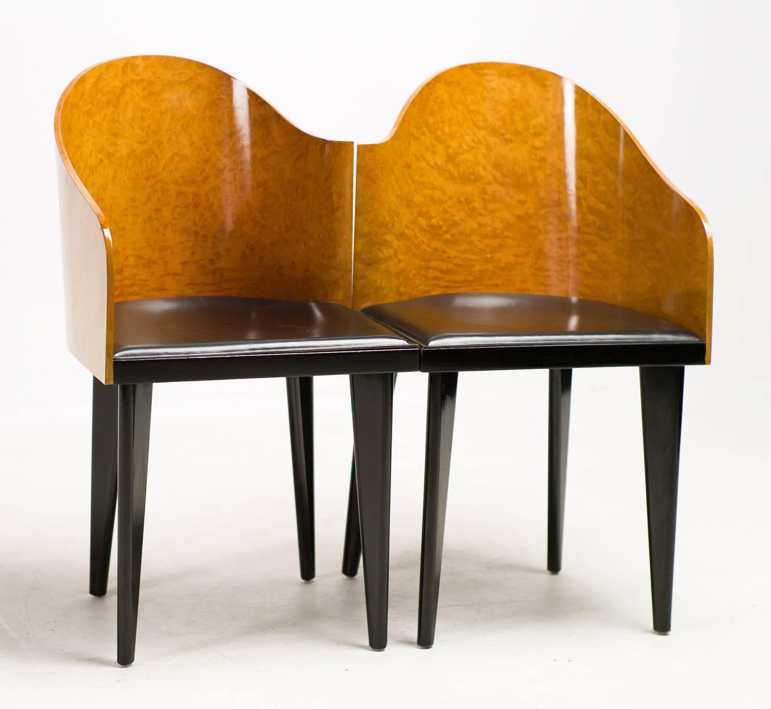 A wonderful pair of asymmetrical chairs by Saporiti.
Curved maple burl veneer back and black leather seat.
Toscana chairs designed in 1986 by Piero Sartogo.

Excellent fast and affordable worldwide shipping.
White glove delivery available upon