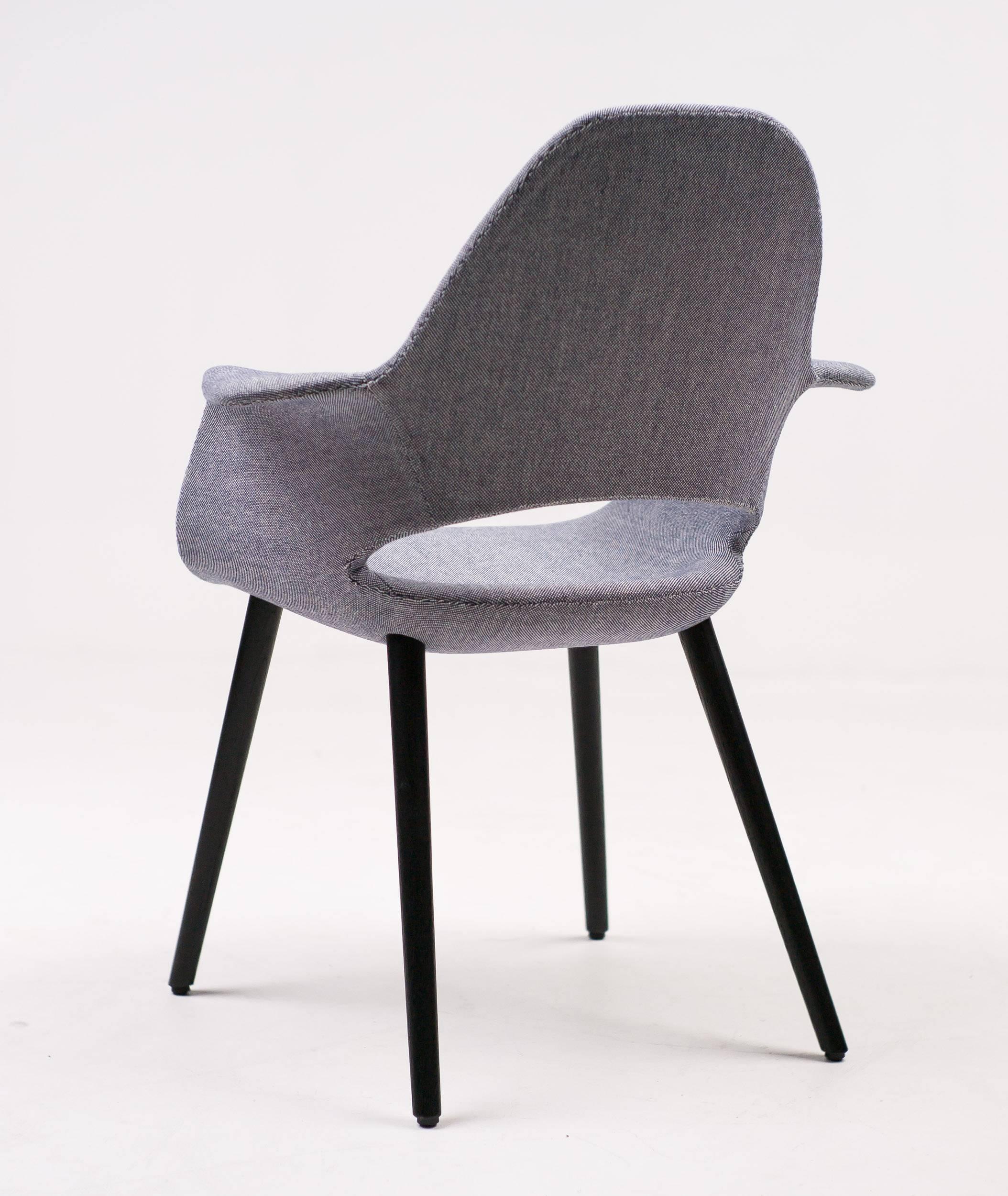 Charles Eames, Eero Saarinen Organic chair, Vitra edition, in dark blue or ivory hopsak with black stained ash legs. Marked with label.
Also known as 