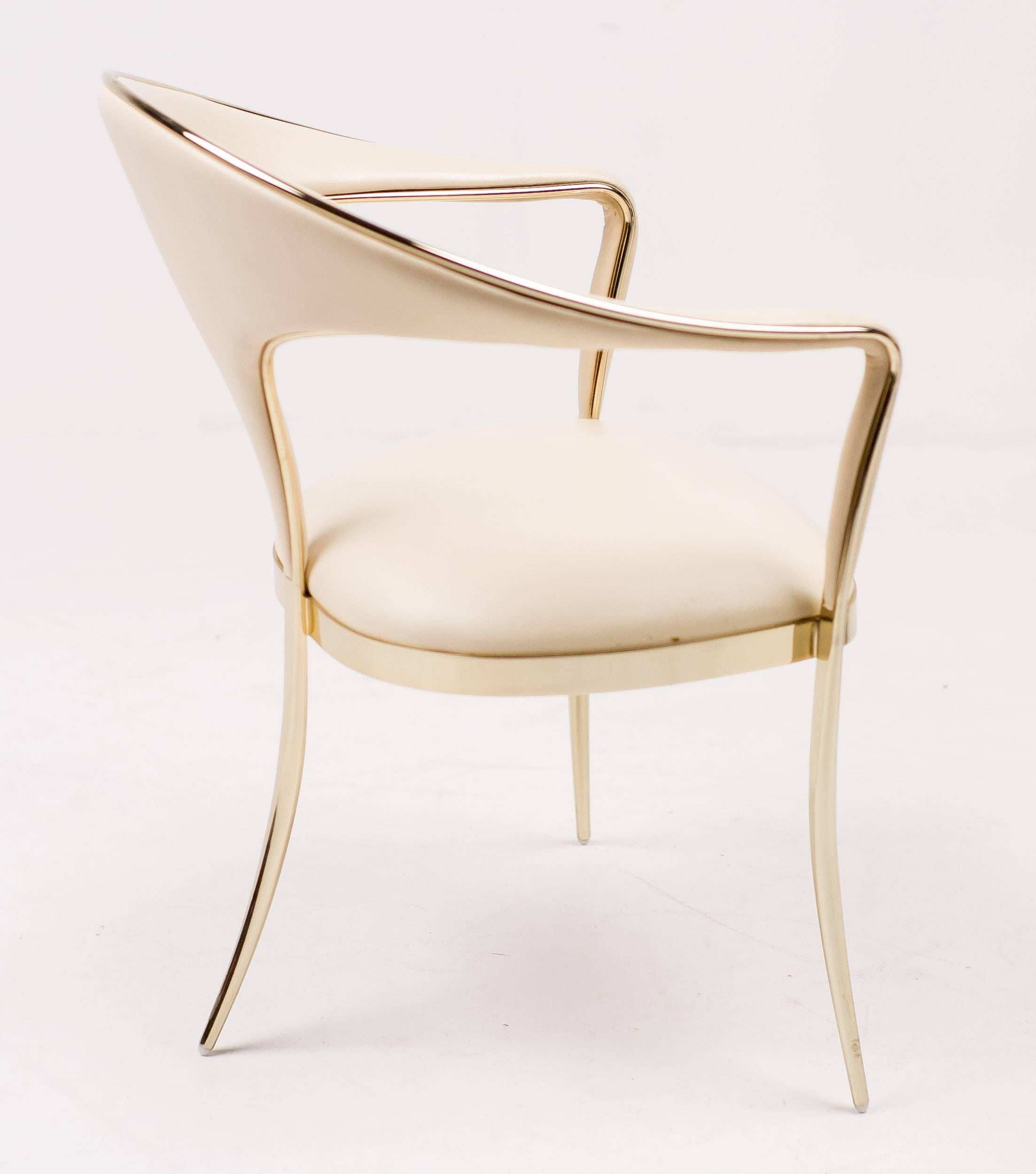 Elegant set of four Vidal Grau Cosmos chairs.
Polished brass frame and legs, upholstery in nappa leather.
With brass label under the seat of each chair.

Excellent fast and affordable worldwide shipping.
White glove delivery available upon