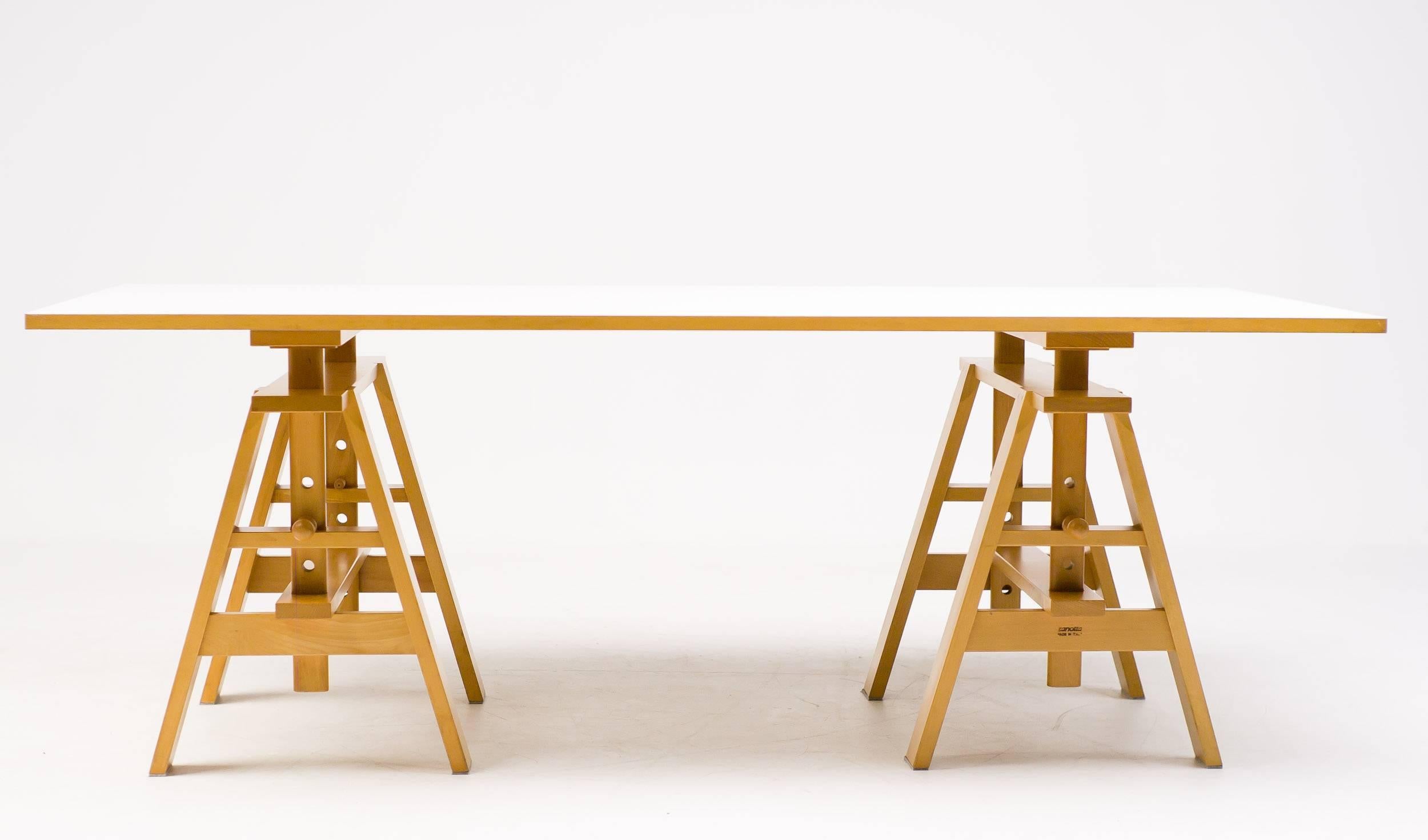 Design Achille Castiglioni, originally designed in 1950, put into production from 1969 onward by Zanotta
Steam-treated beech trestle, particleboard top
Made in Italy by Zanotta

Leonardo table was inspired by and named after Leonardo Da