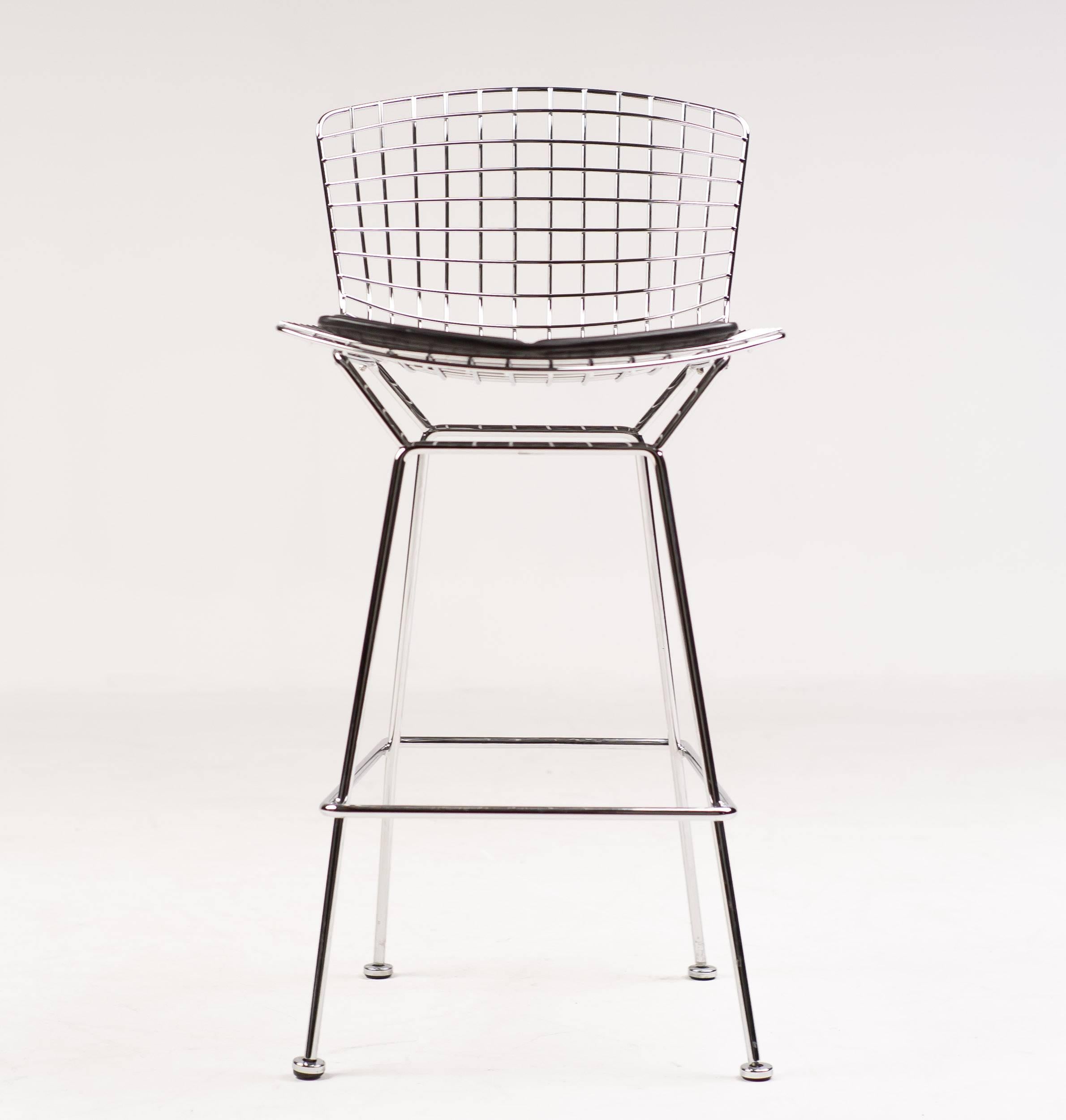 Set of ten counter chairs (as these are proper chairs) by Harry Betoia for Knoll International with black leather seat pads.
In Bertoia's own words; 'If you look at these stools, they are mainly made of air, like a sculpture. Space passes right