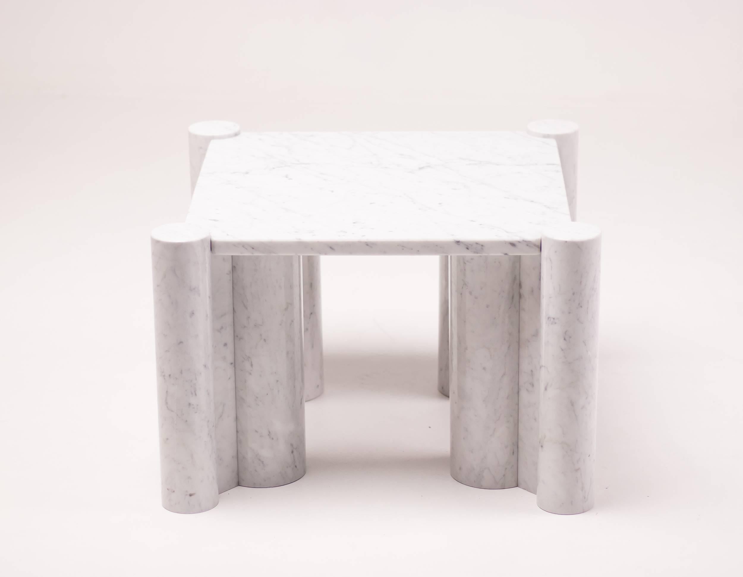 Coffee table 'Jumbo', in Carrara marble, designed by Gae Aulenti for Knoll International, United States, 1965. Sculptural marble coffee table designed by Italian architect Gea Aulenti. Square tabletop with four legs composed of two cylinders. The