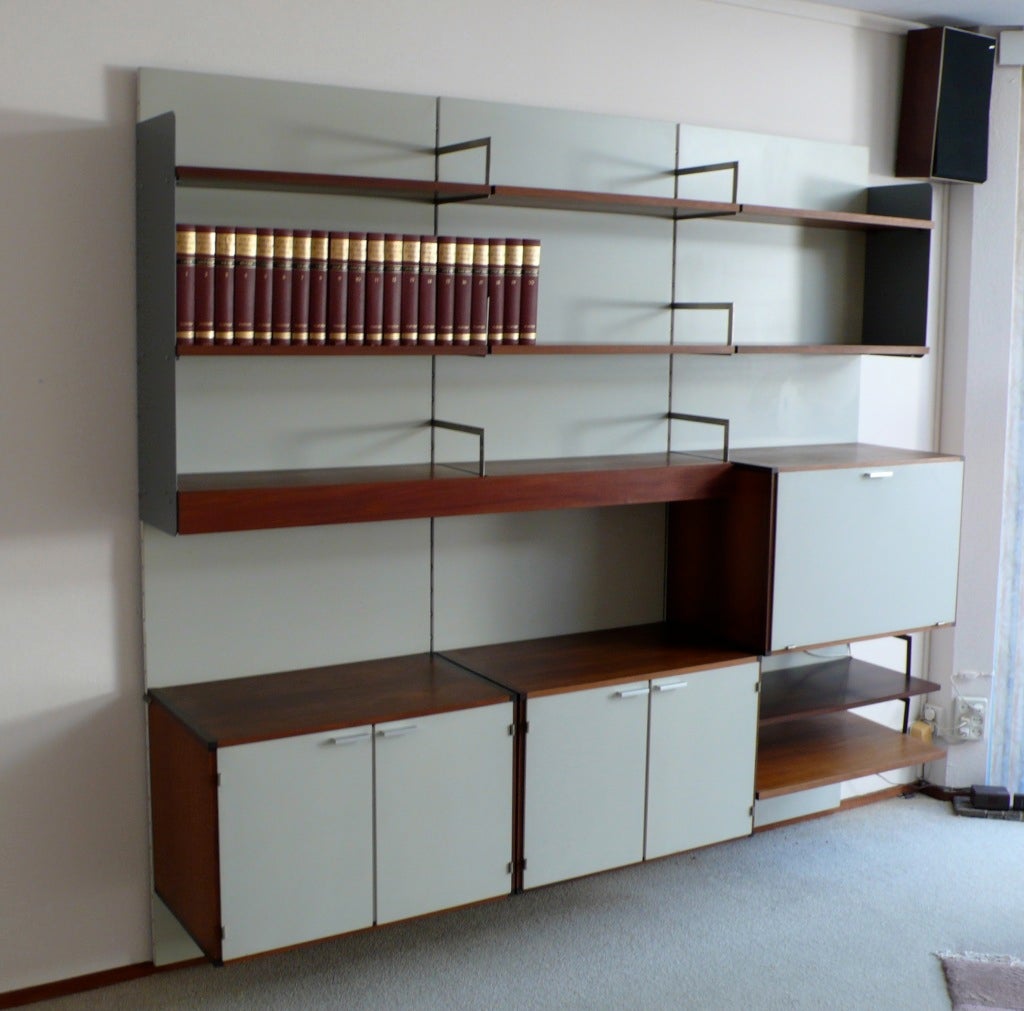Storage system designed by Cees Braakman for the modernist house where the storage system was mounted until we bought it. Has the typical Braakman shelves and cabinets, but the modular wall panels with stainless steel brackets and two grey painted