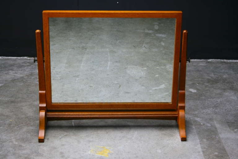 Tilting dressingtable mirror in Arts & Crafts style.
Branded underneath the mirror frame with regal crown and letters AM.