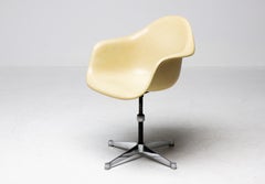 Charles & Ray Eames for Herman Miller – Swiveling Parchment Fiberglass Arm Chair