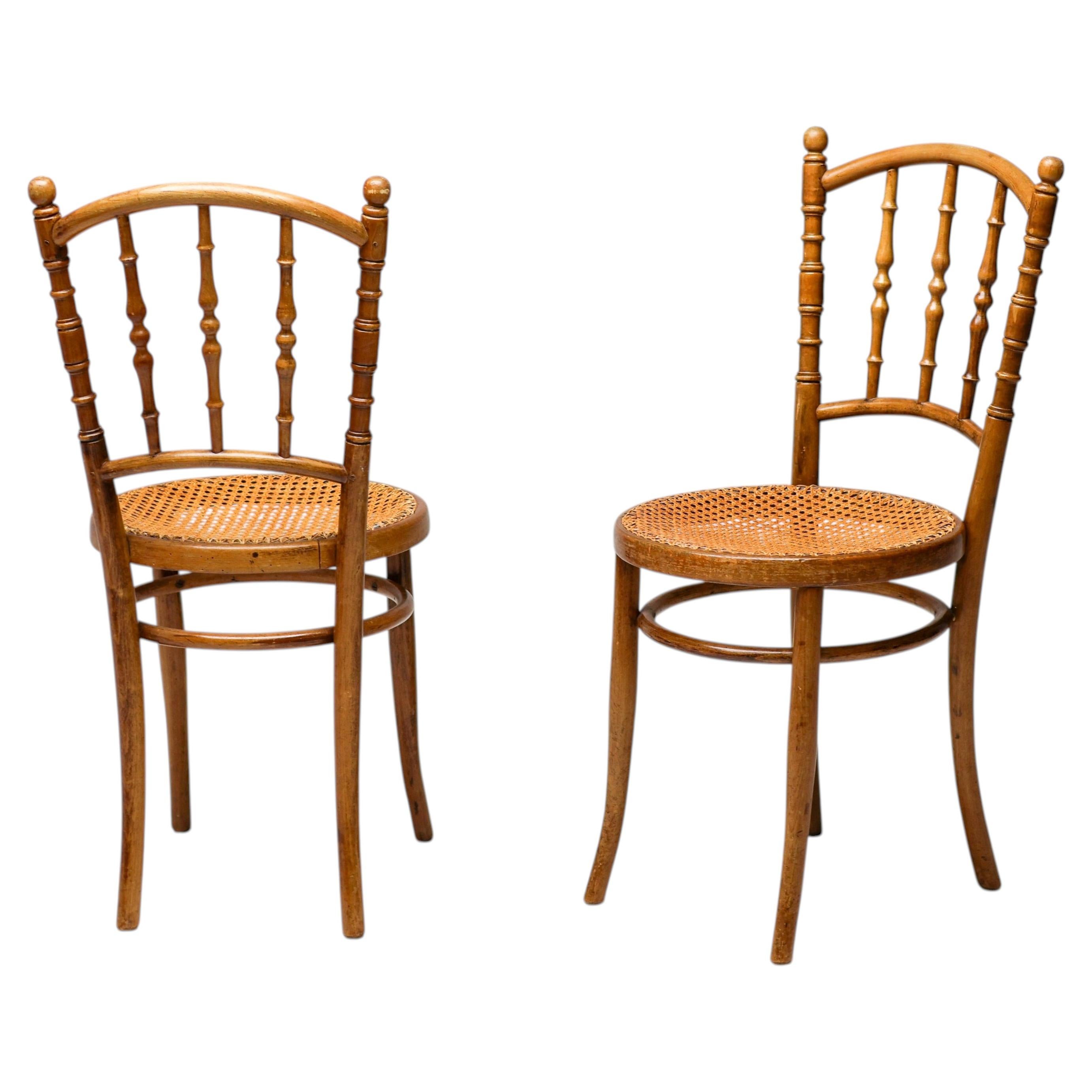 Pair of Jacob & Josef Kohn Bentwood and Rattan Chairs, circa 1950 For Sale