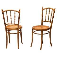 Paire de chaises en bois courbé et rotin signées Jacob & Josef Kohn, vers 1950