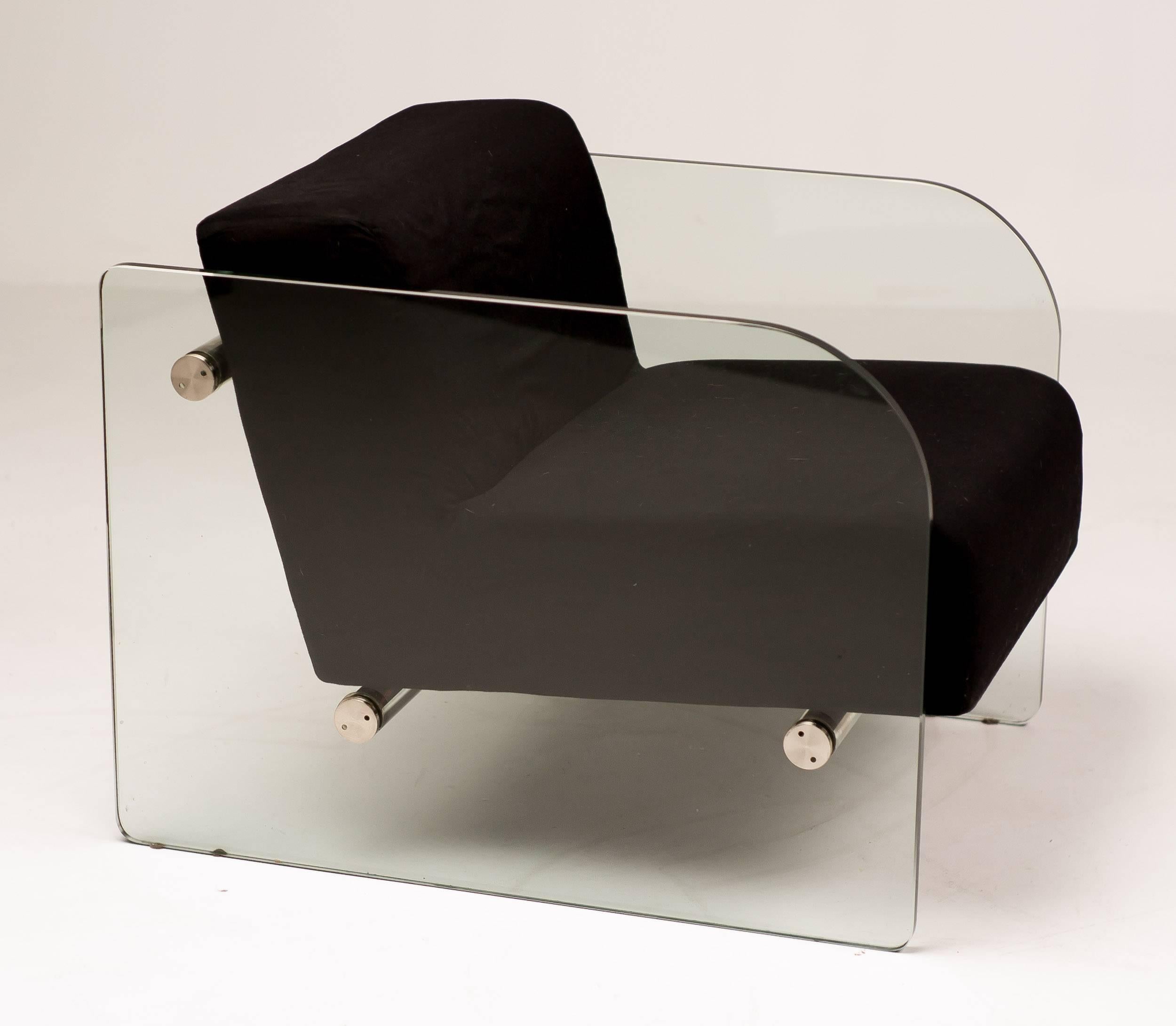 Lounge chair with tempered glass side-panels in the manner of the Hyaline chair by Italian designer Fabio Lenci. The black fabric upholstered seating unit is supported by three stainless steel rods.

Excellent fast and affordable worldwide