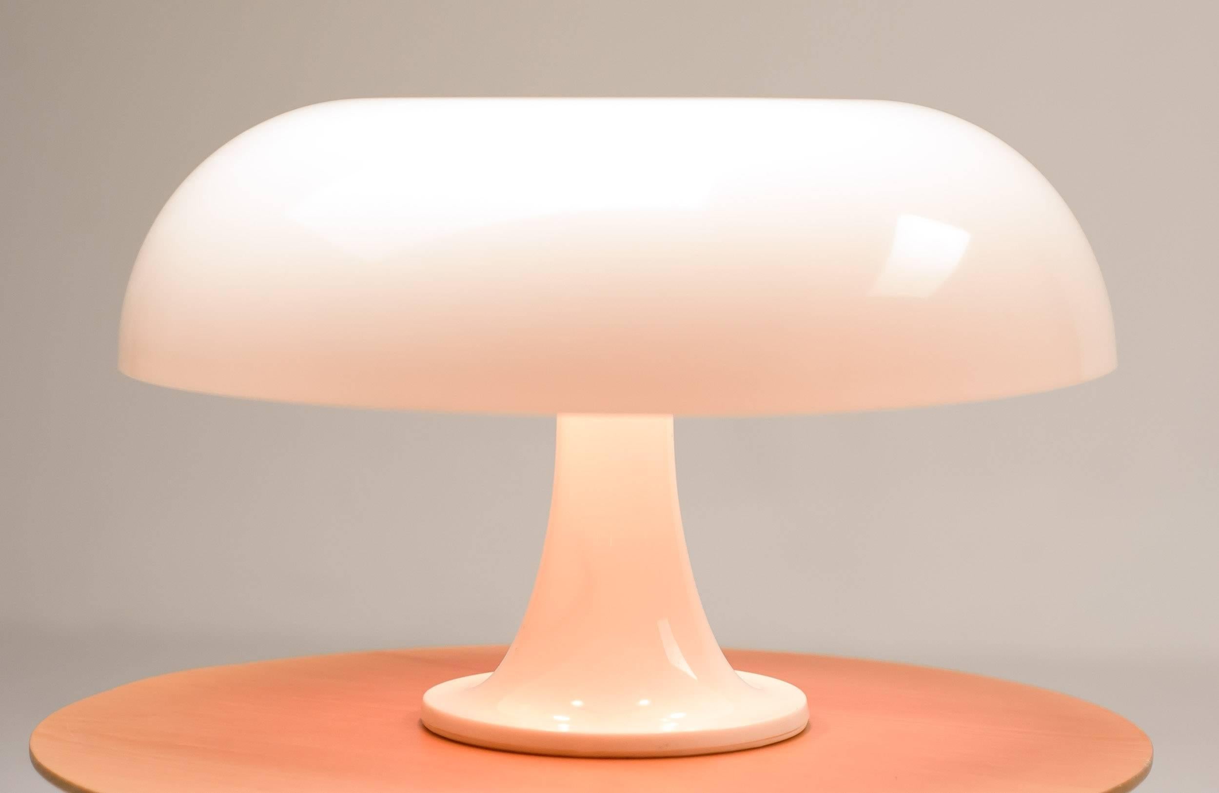 The Nesso table lamp provides general ambient light and features a body and diffuser formed with injection-molded ABS Thermoplastic. This modern classic is included in the collections of many museums, including the MOMA. 
Designed by Giancarlo