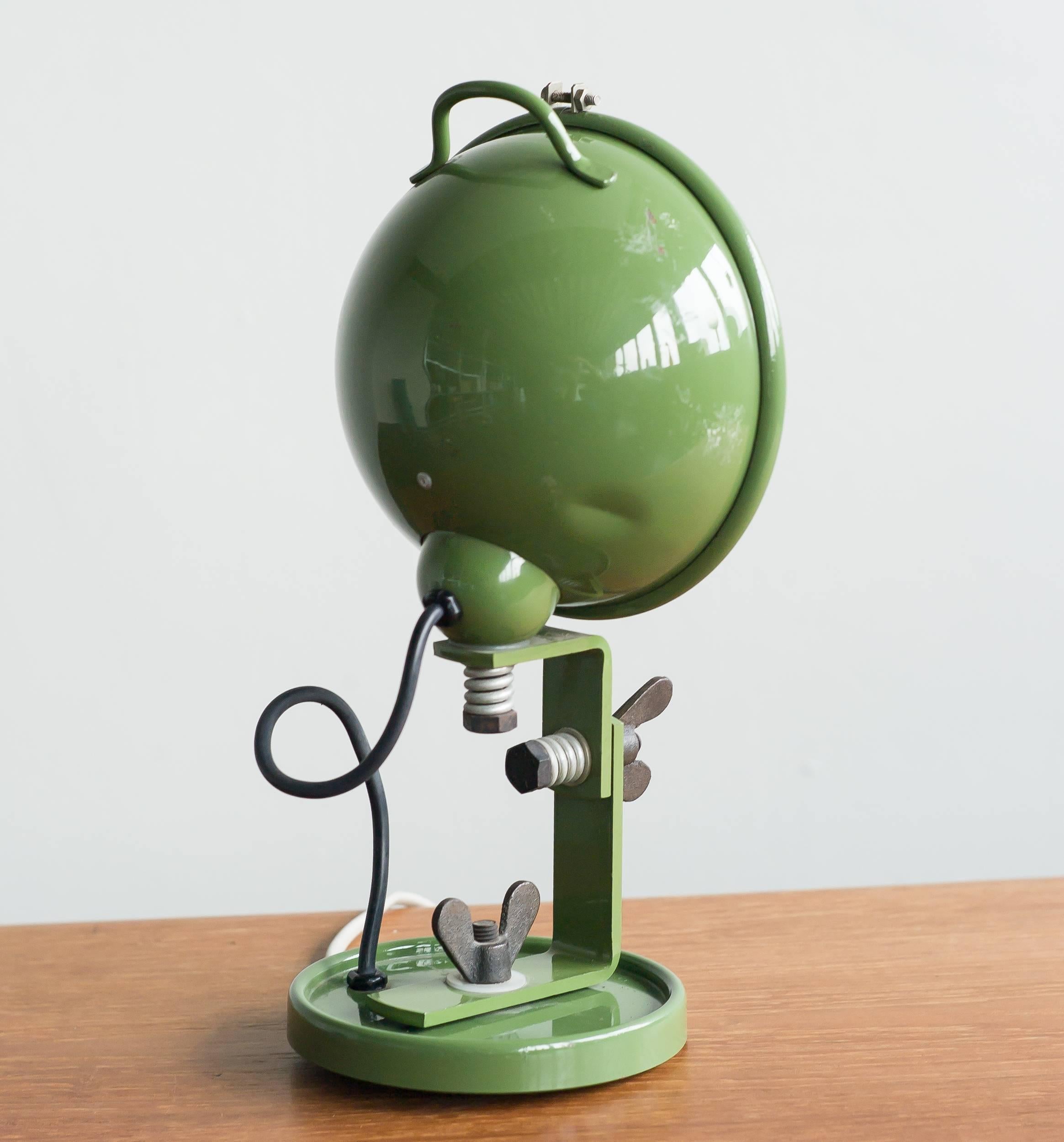 A green lacquered steel lamp model Jeep with glass shade, designed in 1969 by Cesare Leonardi and Franca Stagi for Lumenform, Scorzè, Italy.
Marked in the glass.

         