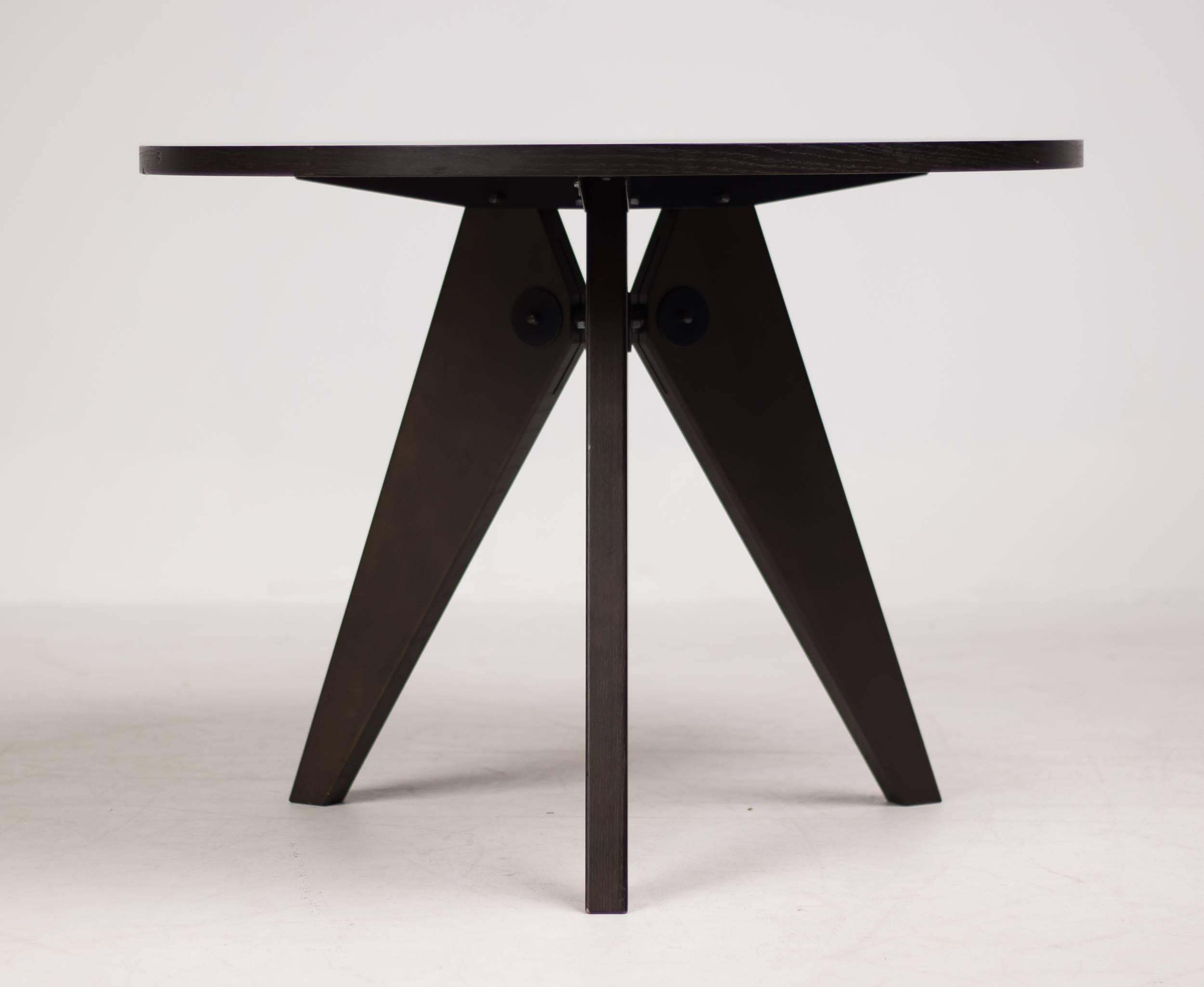 Dark stained oak Guéridon dining table designed by Jean Prouvé for Vitra.
Marked with label. 


  