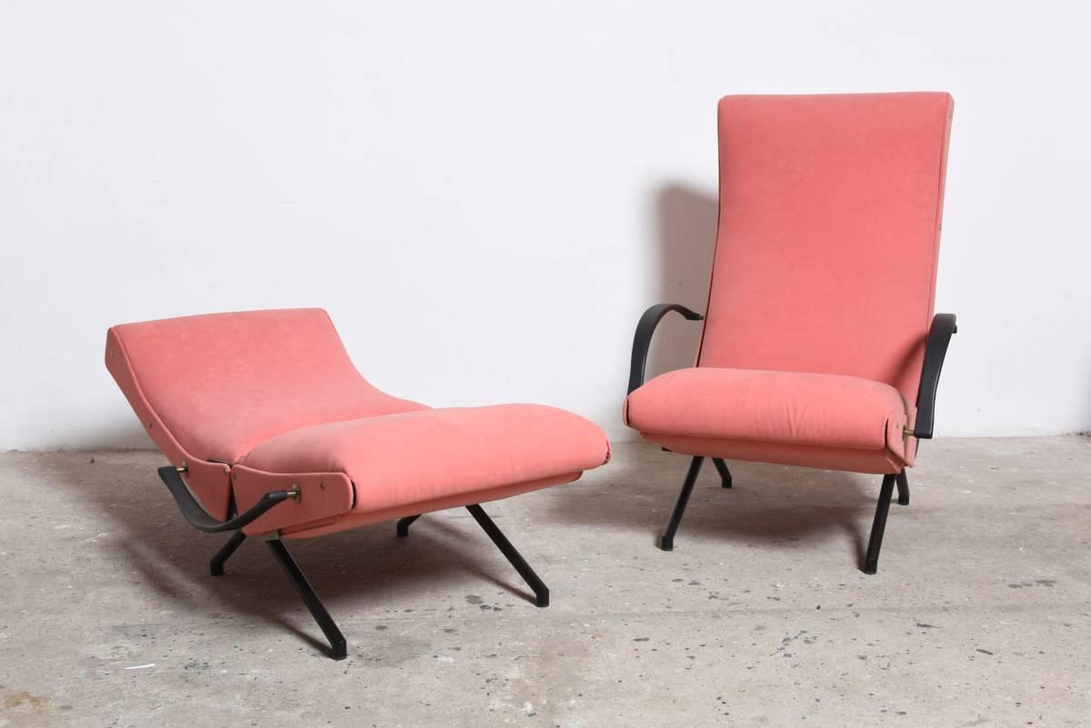 A pair of lounge armchairs, originally designed by architect Osvaldo Borsani for Tecno in 1954, with cushioned backs and seats upholstered in original pink fabric, 

Variable position lounge chair with an enameled steel frame, on slanted linear