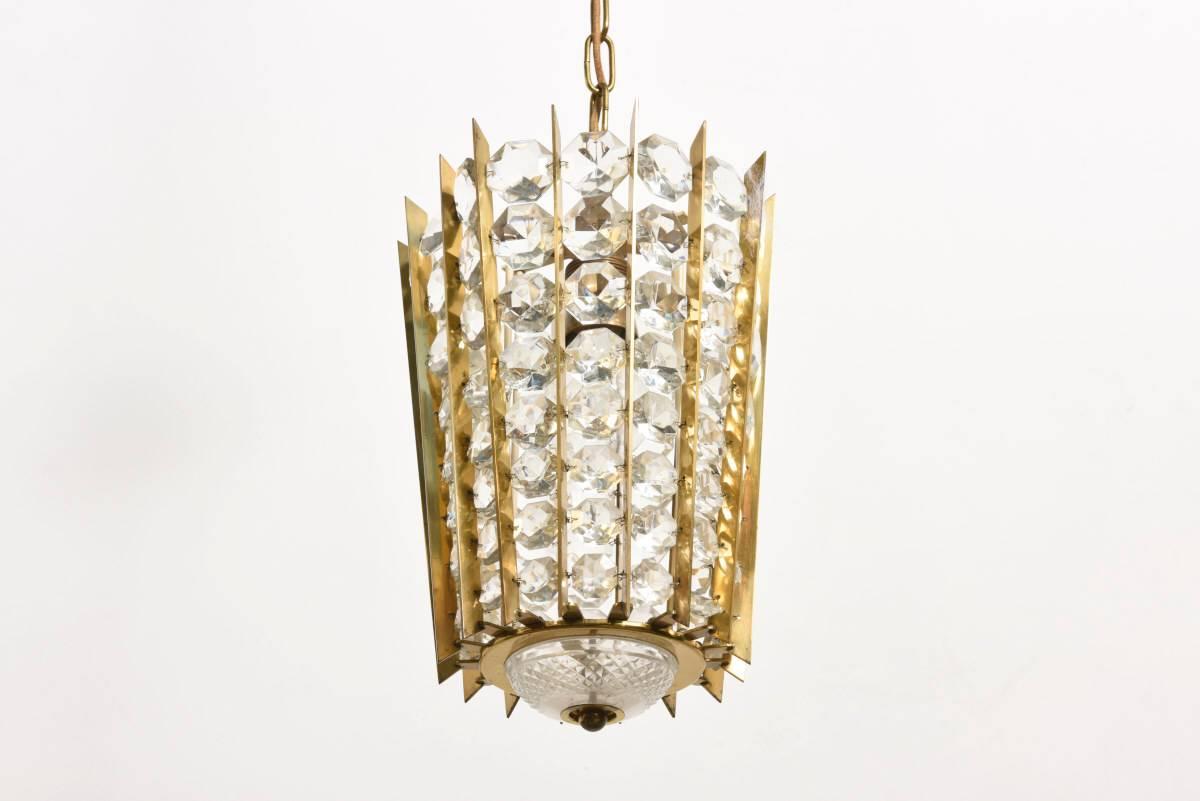 Impressive crystal, brass, gilded chandelier by Bakalowits & Söhne.
Brass construction with faceted diamond shaped crystals.