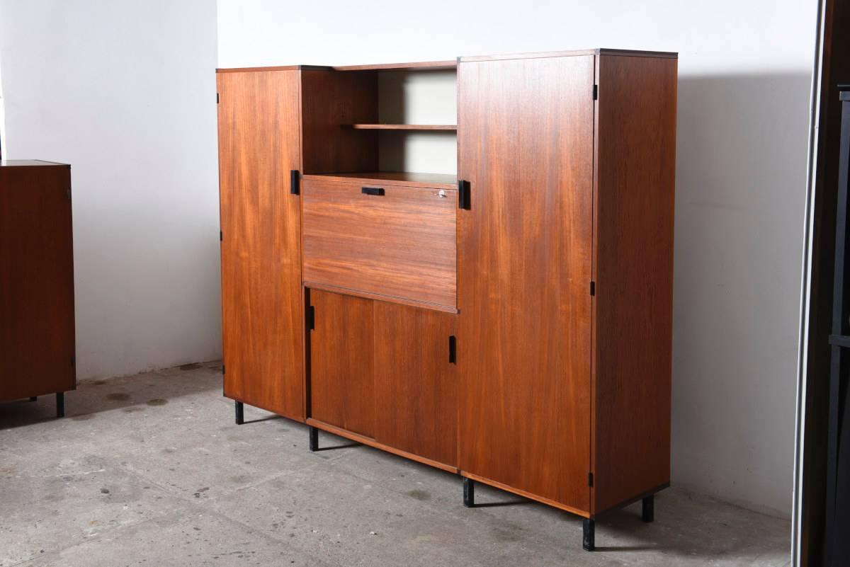 Cees Braakman designed his made to measure system in the late 1950s for Pastoe. 

With a few elements you can build any kind of cabinet using a simple key. With this system Braakman was far ahead of his time. 
The basic features of his design are a