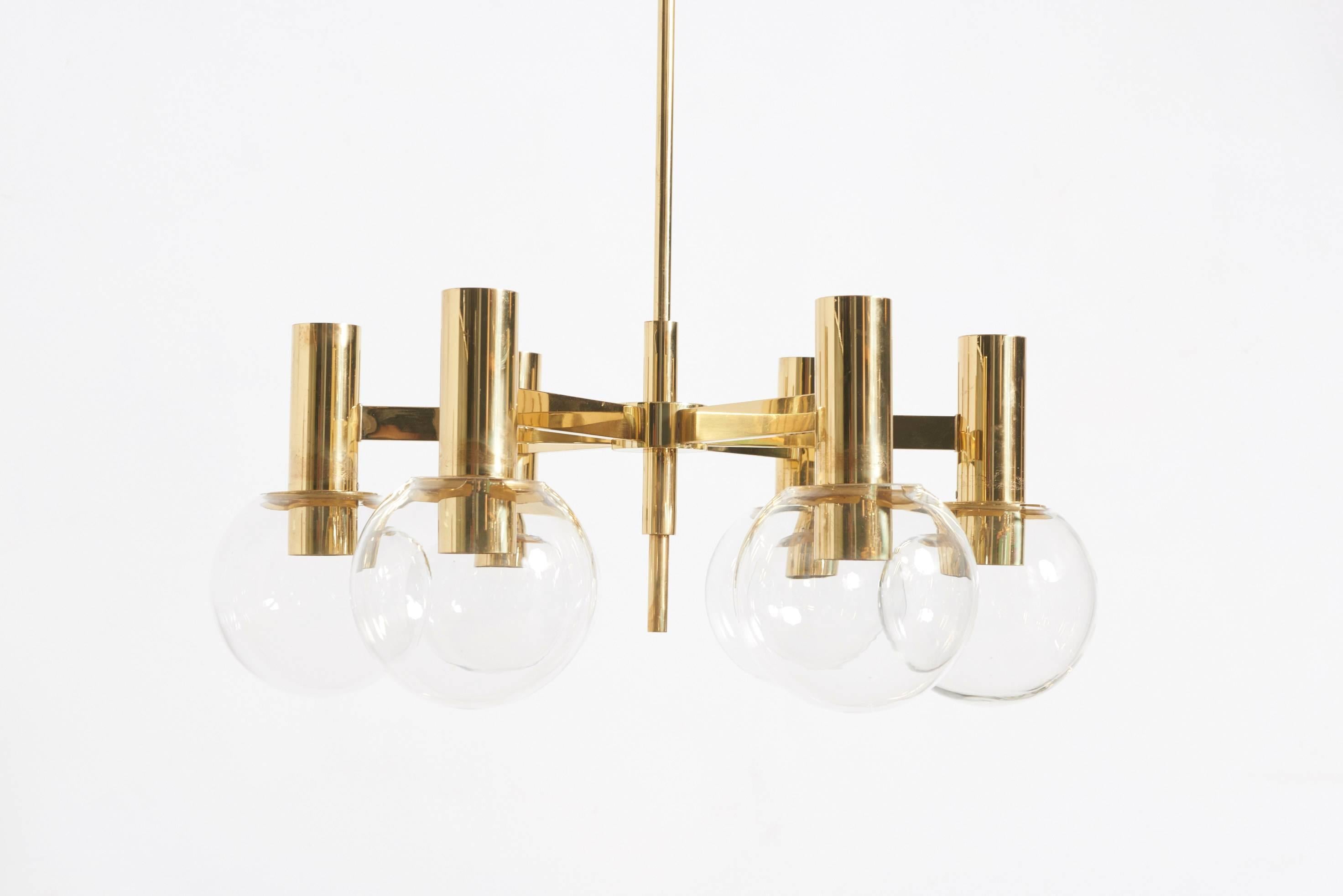 A large and impressive six-armed chandelier in brass with clear glass shades designed by Hans-Agne Jakobsson for Hans-Agne Jakobsson AB,Markaryd, Sweden.


Hans-Agne Jakobsson was one of the world’s most versatile and productive lighting