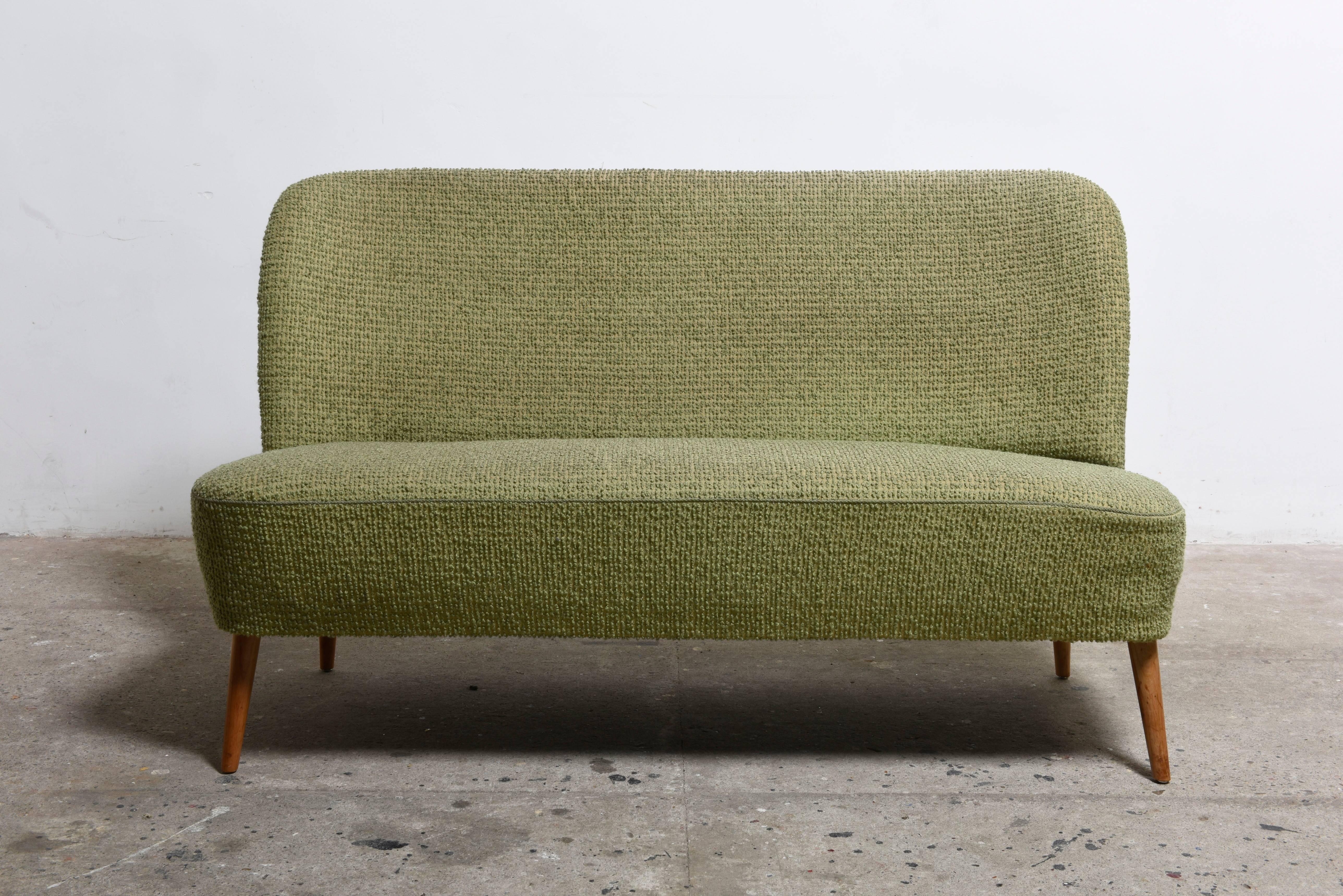 Great and rare 1950s Artifort loveseat,cocktail bench.
Normal seat height a beautiful small version make the green sofa very special.