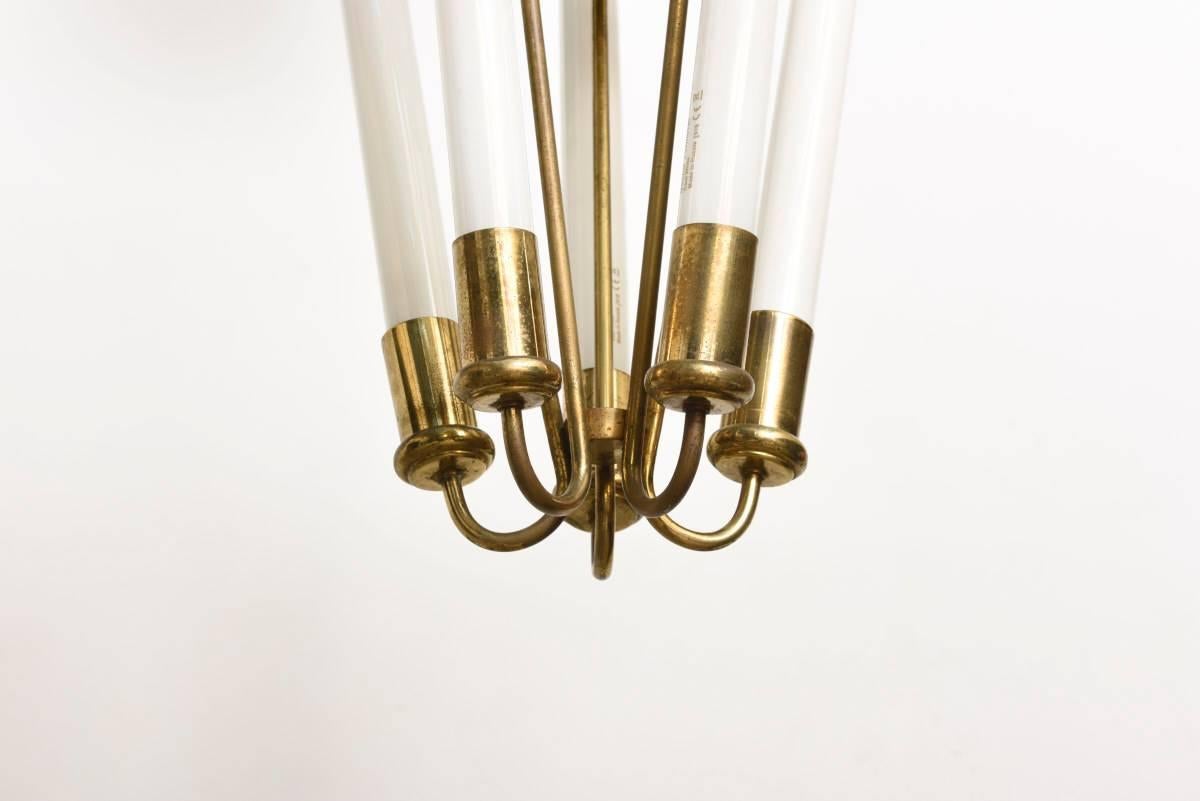 Brass tube pendant, this large lobby lamp was designed and manufactured in Germany 1930s in a modernist Bauhaus style. 

It features five fluorescent tubes with two reserve tubes. 
The brass has signs of wear and the electrics have been renewed