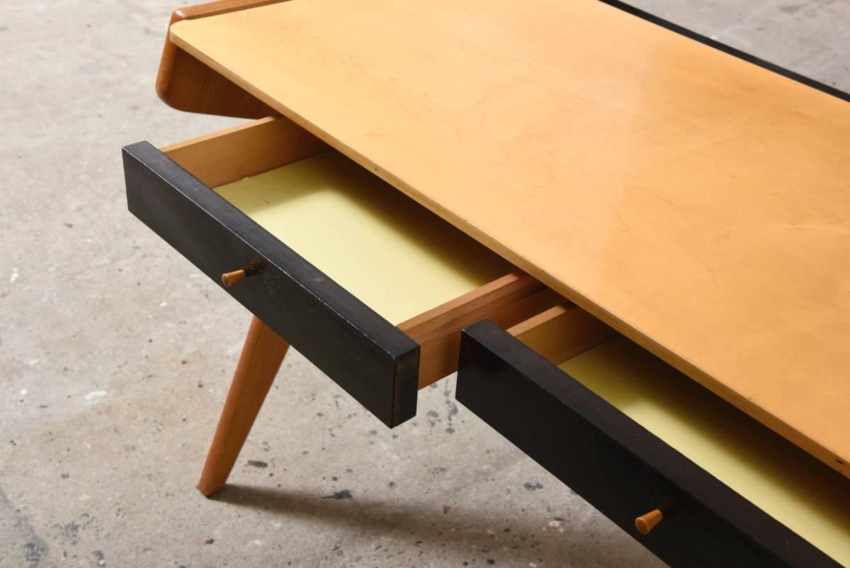 Ladies writing-desk with frame and top of cherrywood designed in 1952 by Helmut Magg for WK Mobel.
 
V-shaped leg position, drawer fronts and shelf with black laminate.

Version new community for home decor, signed WK Mobel. 
Literature: 'How