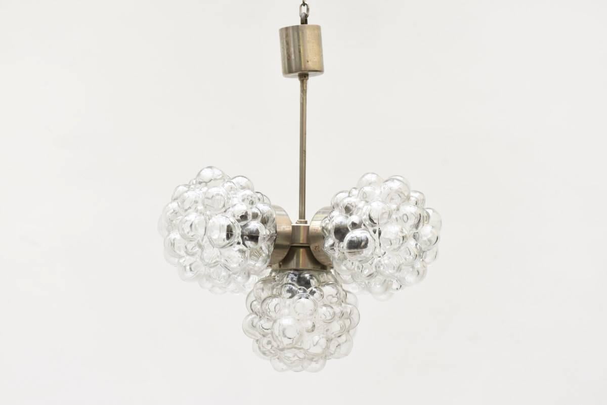 Beautiful bubble glass chandelier or pendant light designed by Helena Tynell for Glashütte Limburg, Germany.
Clear bubble glass and metal chromed frame in very good condition.