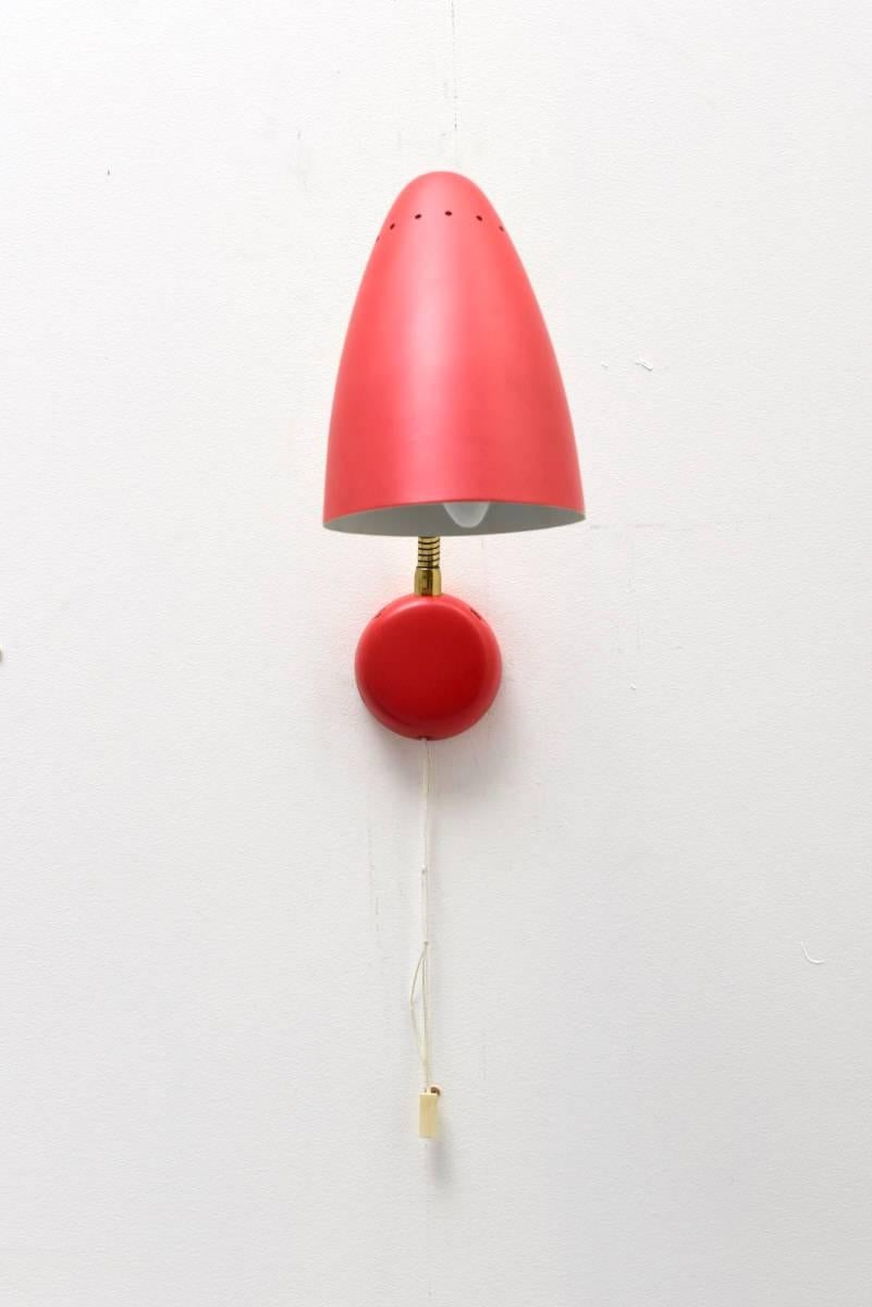 Adjustable goose neck wall lamp was produced by Stilnovo in Italy. The 'goose neck' made from brass, the lampshade is red enameled shade with red enameled base.The lamps are in a very good vintage condition.