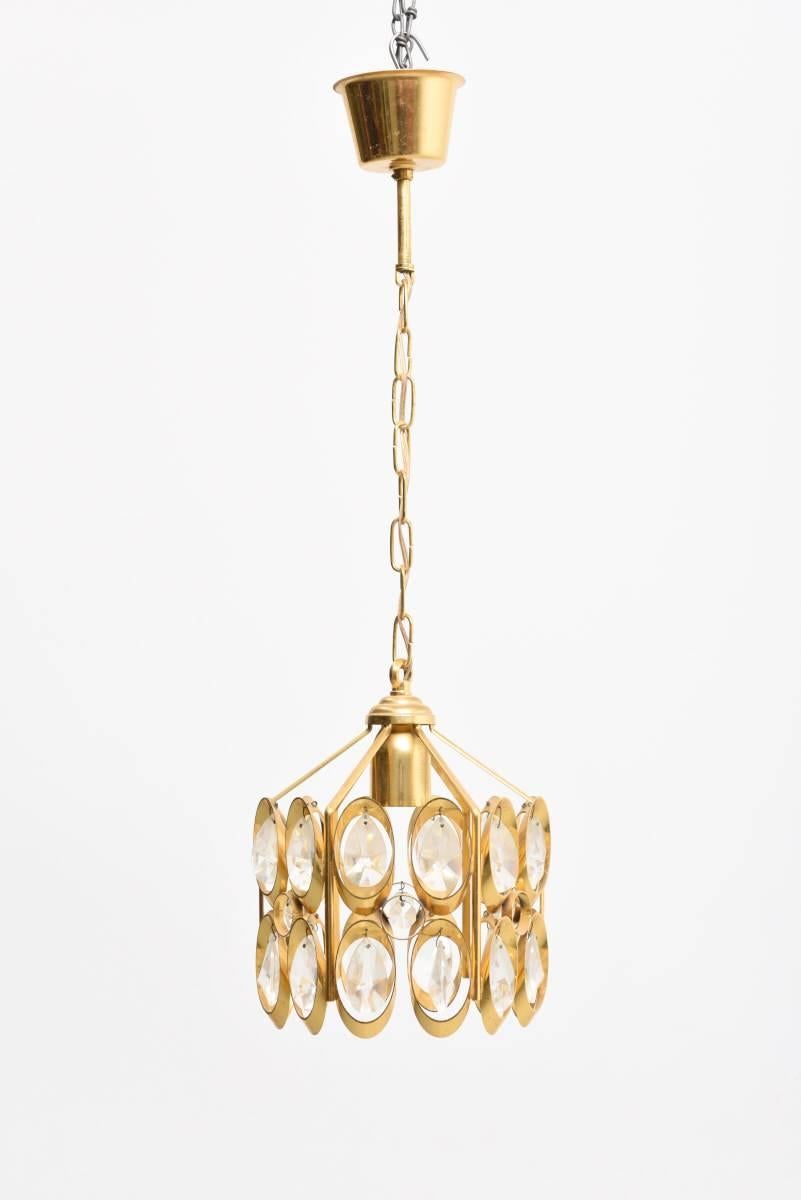 Exclusive pendant chandelier by Palwa, Germany. Made of a gilded 24-karat plated brass frame and faceted crystals.