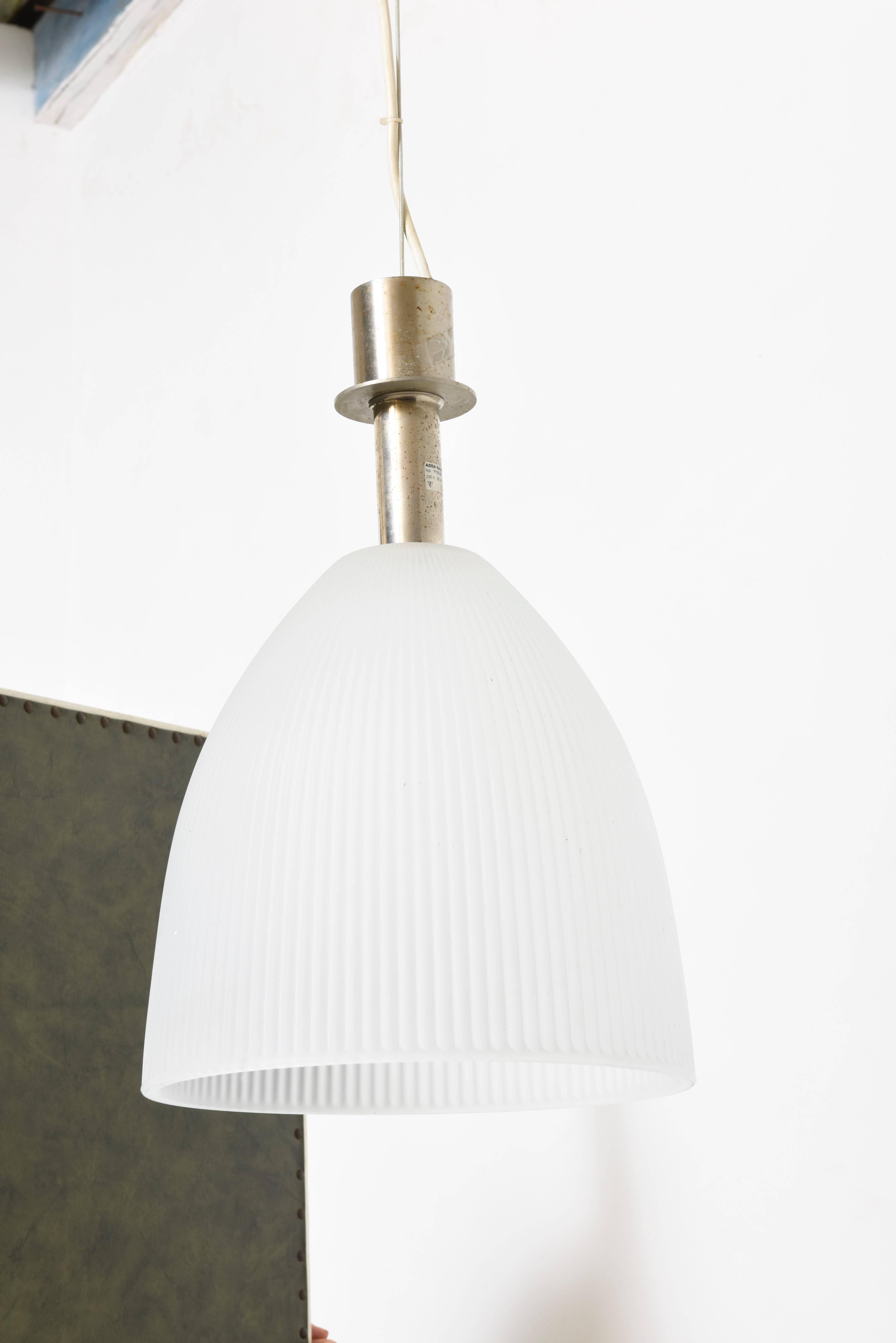 The authentic, Halophane glass shade diffuses light to provide functional and stylish illumination.

The pendant is a standout in any room and provides a fun and functional way to light islands, bars or dining areas and can be used individually or