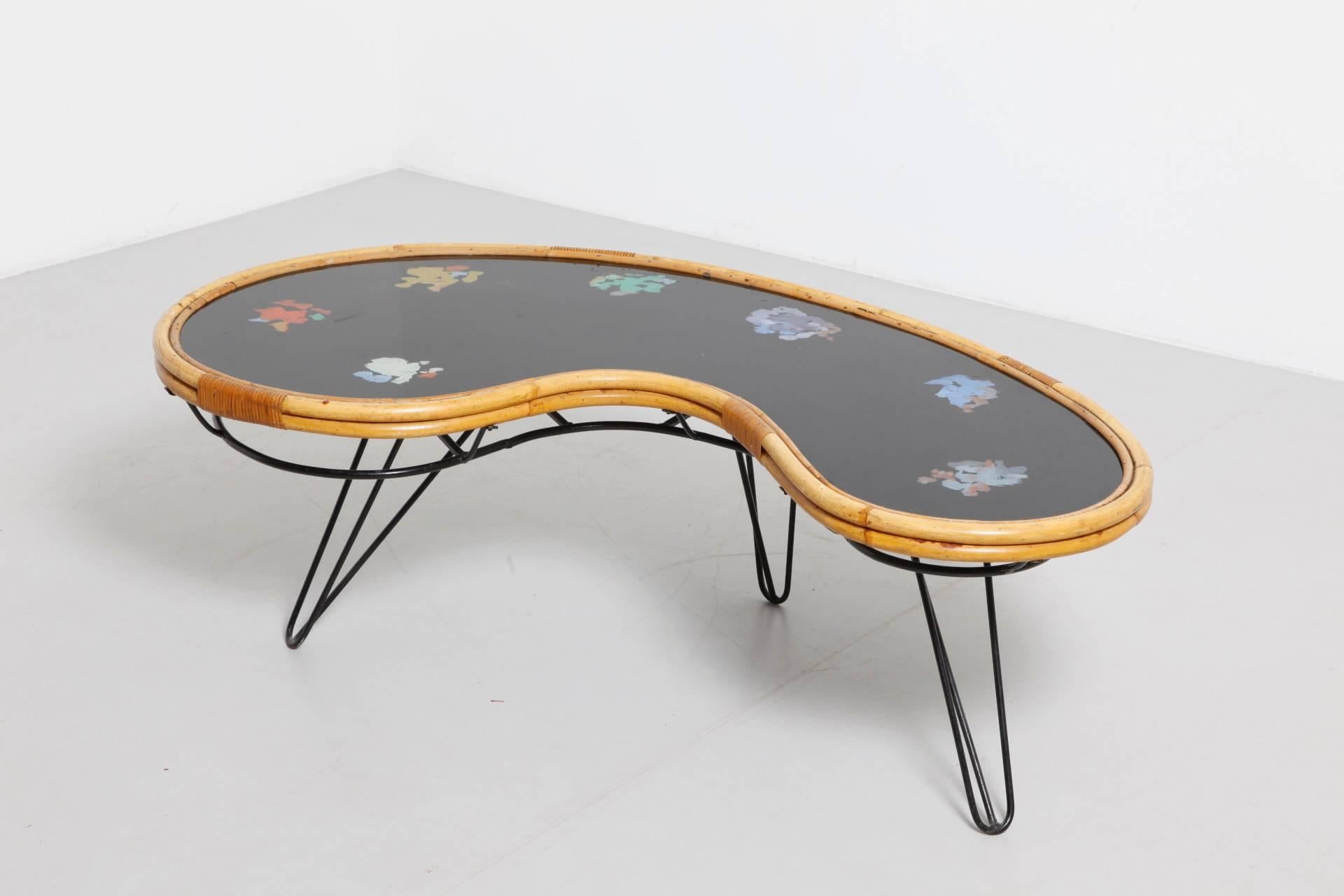 Whimsical original 1950s bamboo kidney-bone designed coffee table.

 The hairpin legs are made from stainless steel bar, with a glass top decorated as a painters-pallet.
Original unique piece from the 1950s.