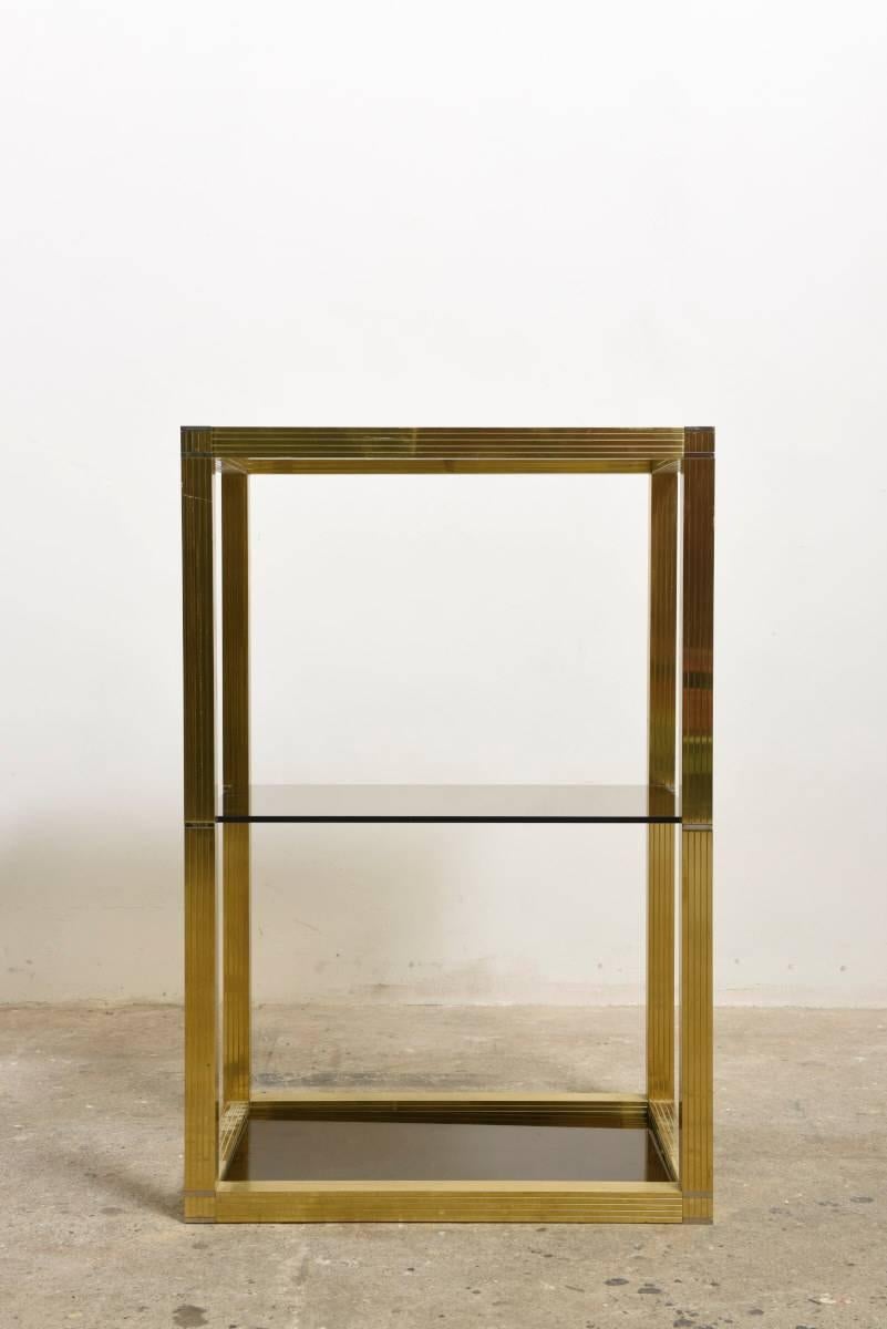 Beautiful Romeo Rega rectangular vitrine with three smoked glass tops supported by a brass frame with chrome accents.