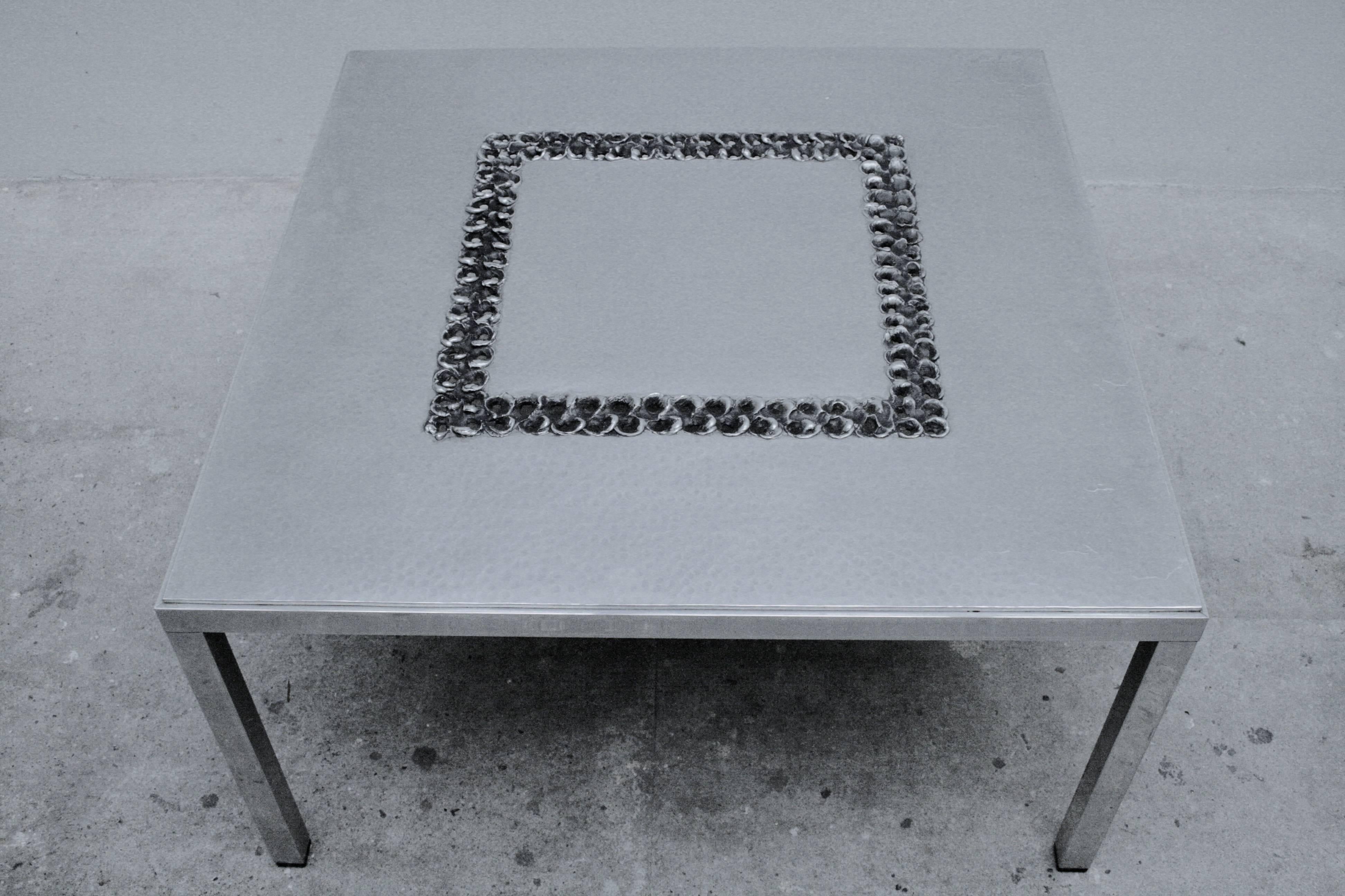 This impressive Brutalist aluminum coffee table was designed by Luyckx W. for Aluclair Belgium in the 1970s. 

This low coffee table is handmade in a special technique with aluminum to create a Brutalist effect.

Labeled by W.Luyckx, ALUCLAIR,