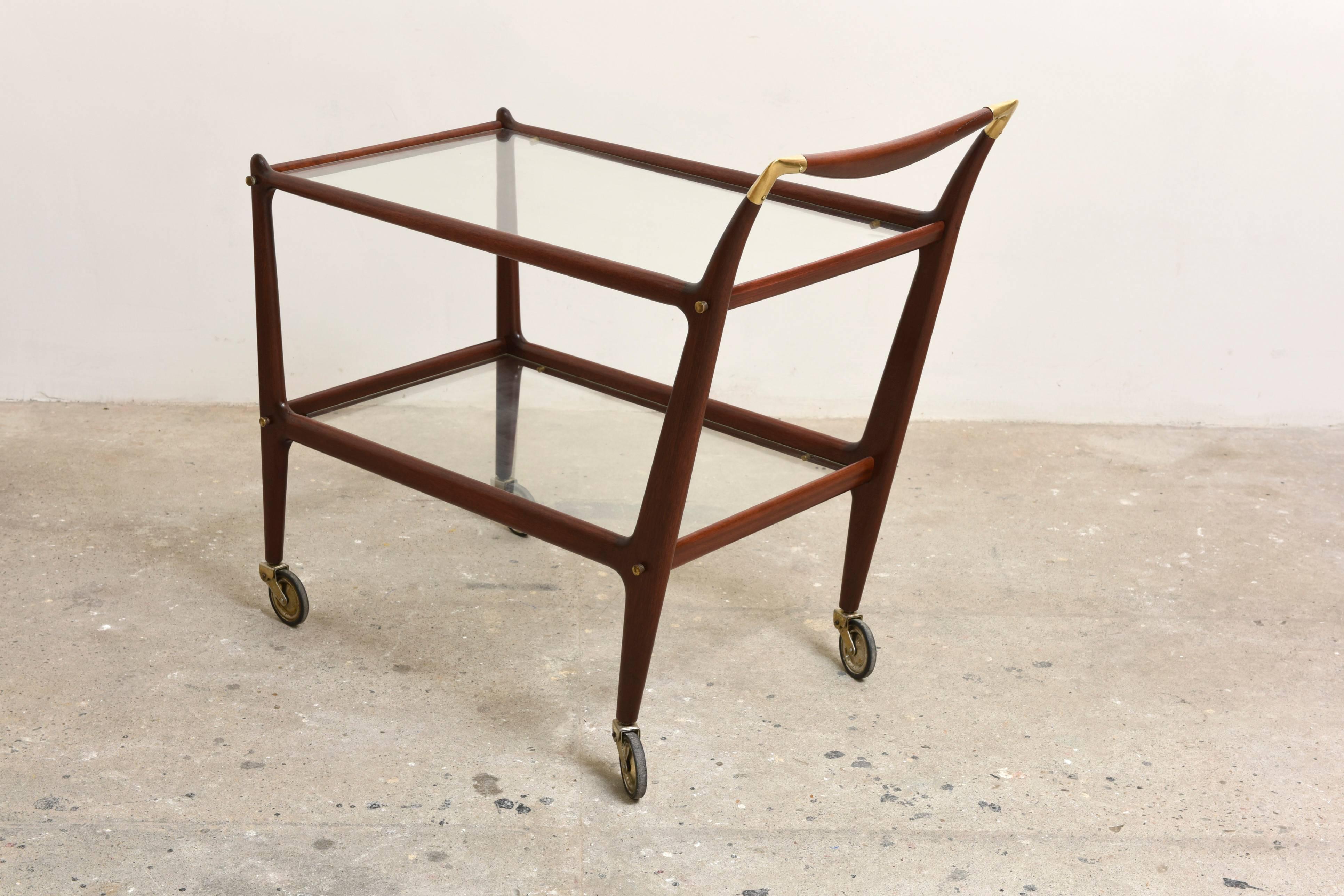 Iconic bar cart by Italian designer Cesare Lacca. 

Brass and walnut frame with original castors, in mint condition.