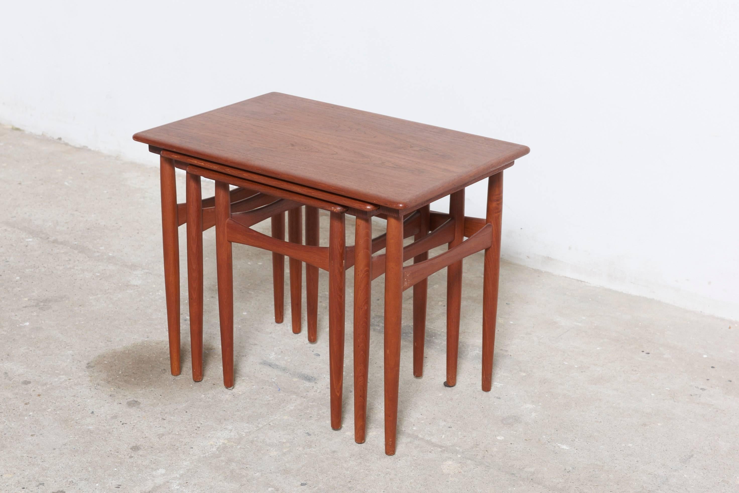 Teak set of three in very good condition nesting tables, delicately tapered legs. Finely detailed, nicely proportioned and exceptionally elegant.
Stamped with Danish Control.