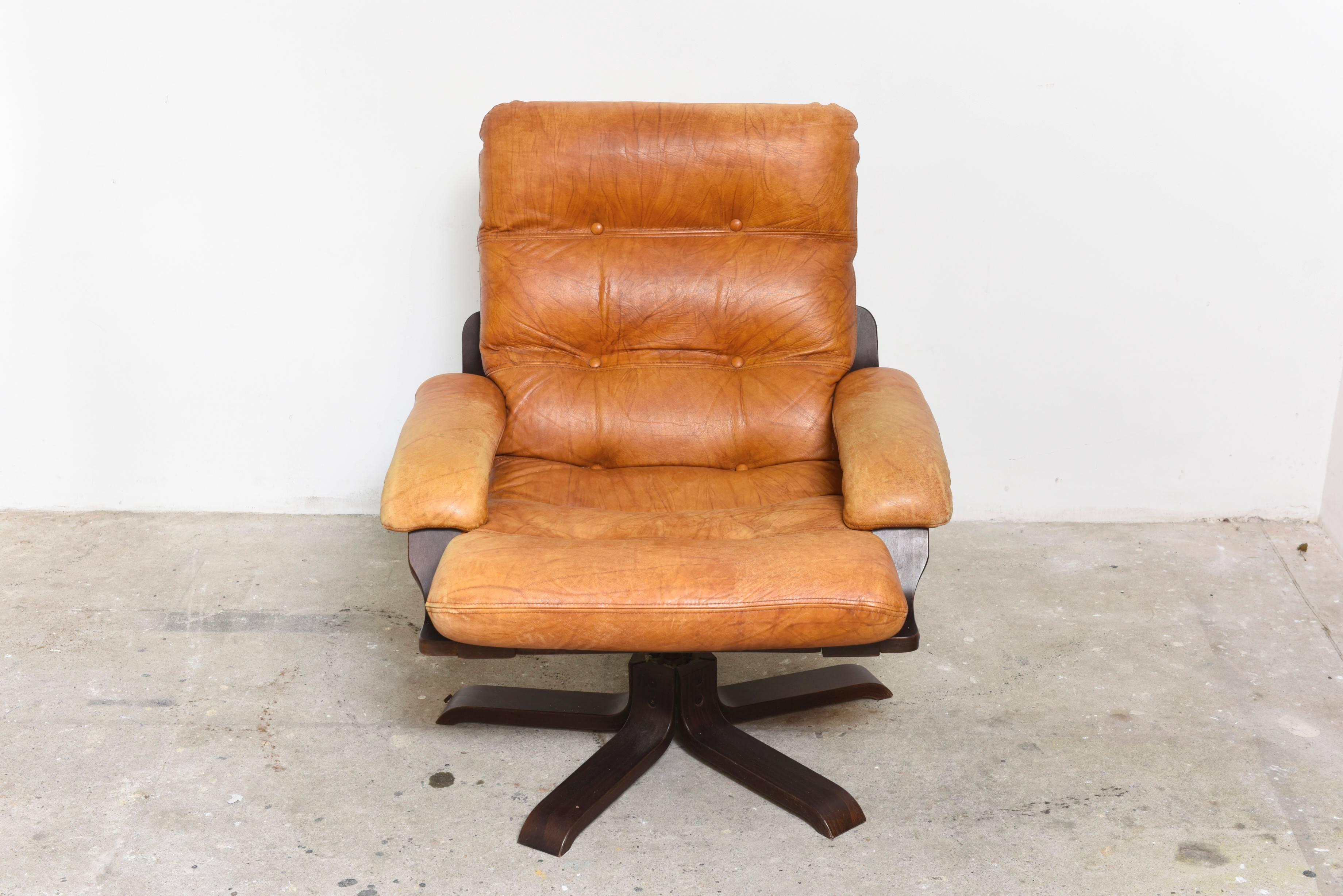 Pair Nordic Cognac Leather Swivel Lounge Chairs at 1stDibs cognac