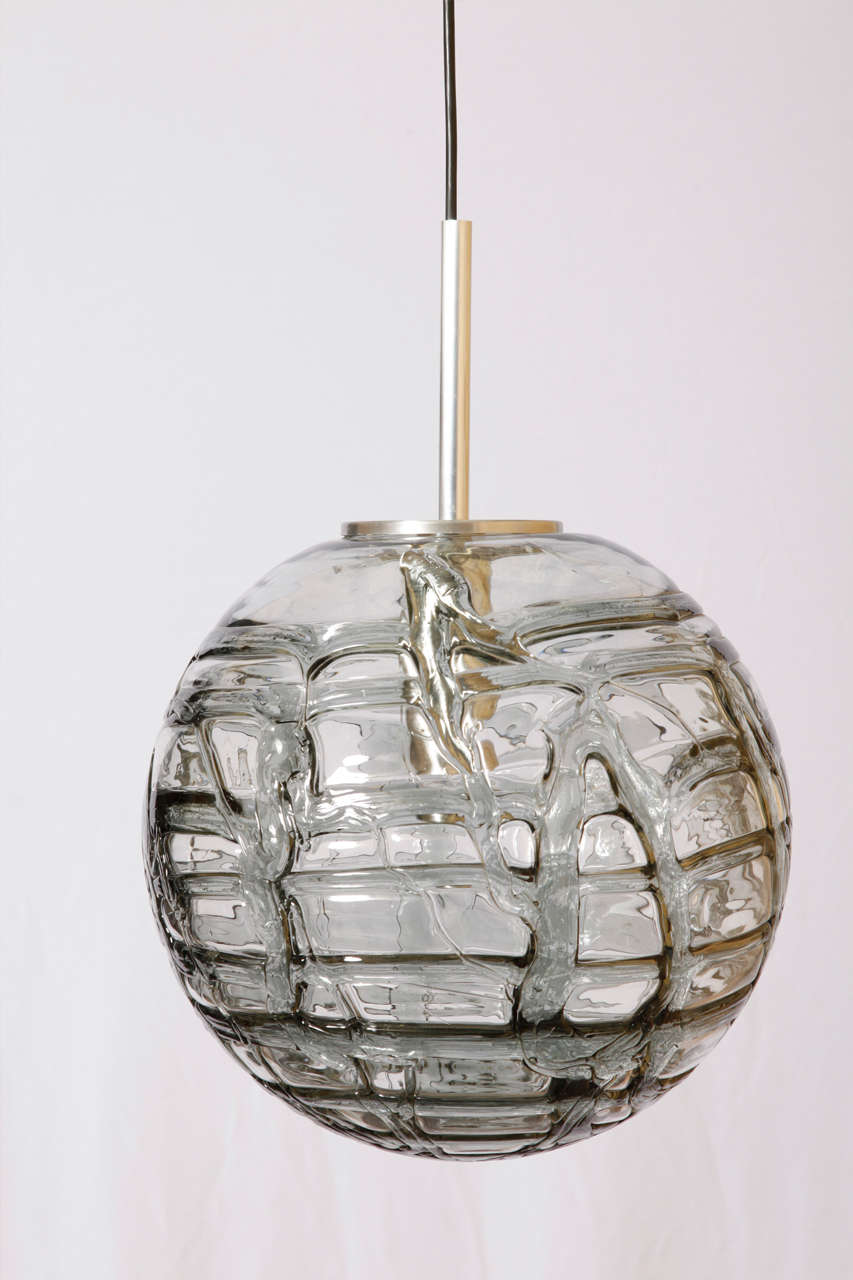 Doria beautiful pendant, simply in design, handcrafted blown glass globes with grey toned swirls textured a fine stylish chrome body and blacktop, Germany, 1960s.
Very suitable as a single lamp or due to the diversity of various sizes of the globes